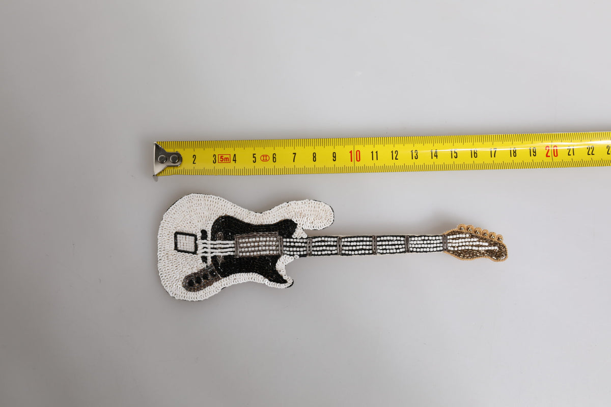 Indulge in the exquisite Dolce & Gabbana Gold Brass Logo Beaded Guitar Pin Brooch, a luxurious blend of artistry and elegance, crafted in Italy for the discerning individual.