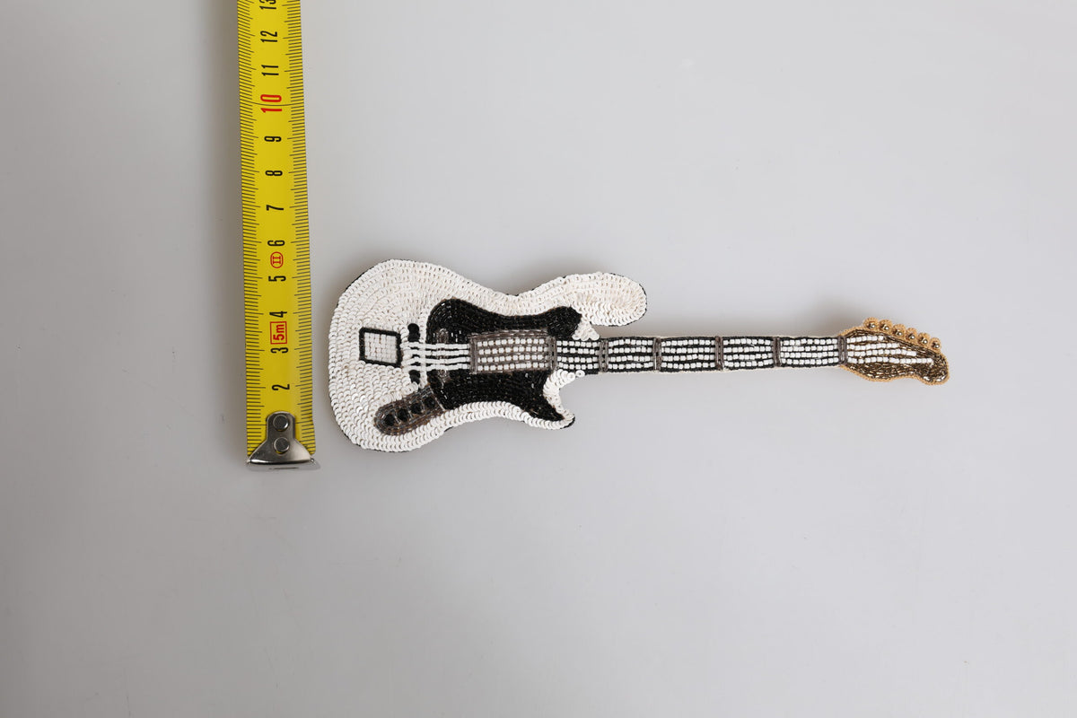 Discover the exquisite Dolce & Gabbana Gold Brass Logo Beaded Guitar Pin Brooch, a luxurious blend of artistry and elegance, perfect for the discerning individual.