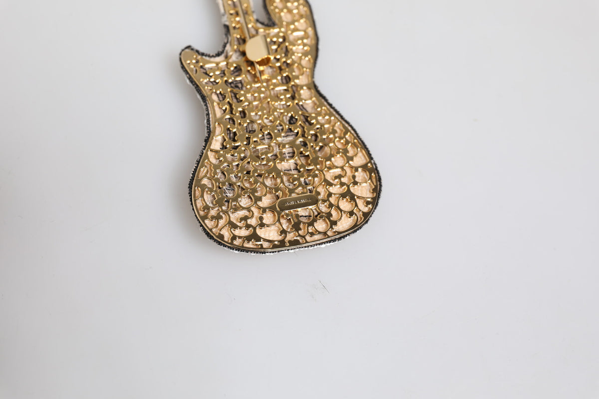 Elevate your style with the Dolce & Gabbana Gold Brass Logo Beaded Guitar Pin Brooch, an exquisite blend of artistry and luxury crafted in Italy for the discerning individual.