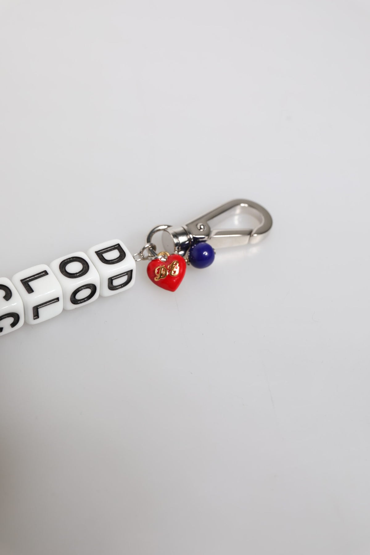 Elevate your elegance with the Dolce & Gabbana Silver Brass Chain Dice Logo Charm Bracelet, a luxurious blend of exquisite craftsmanship and playful sophistication, perfect for the discerning individual.