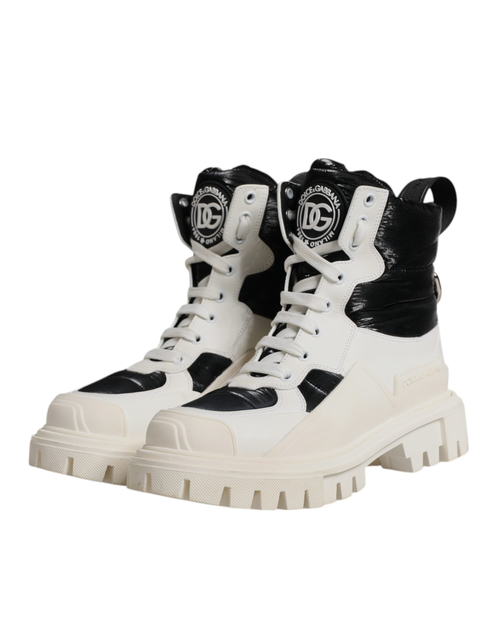 Step into a realm of elegance with Dolce & Gabbana's White Padded Mid Calf Lace Up Boots, where luxurious calf leather meets exquisite Italian craftsmanship for unparalleled allure.