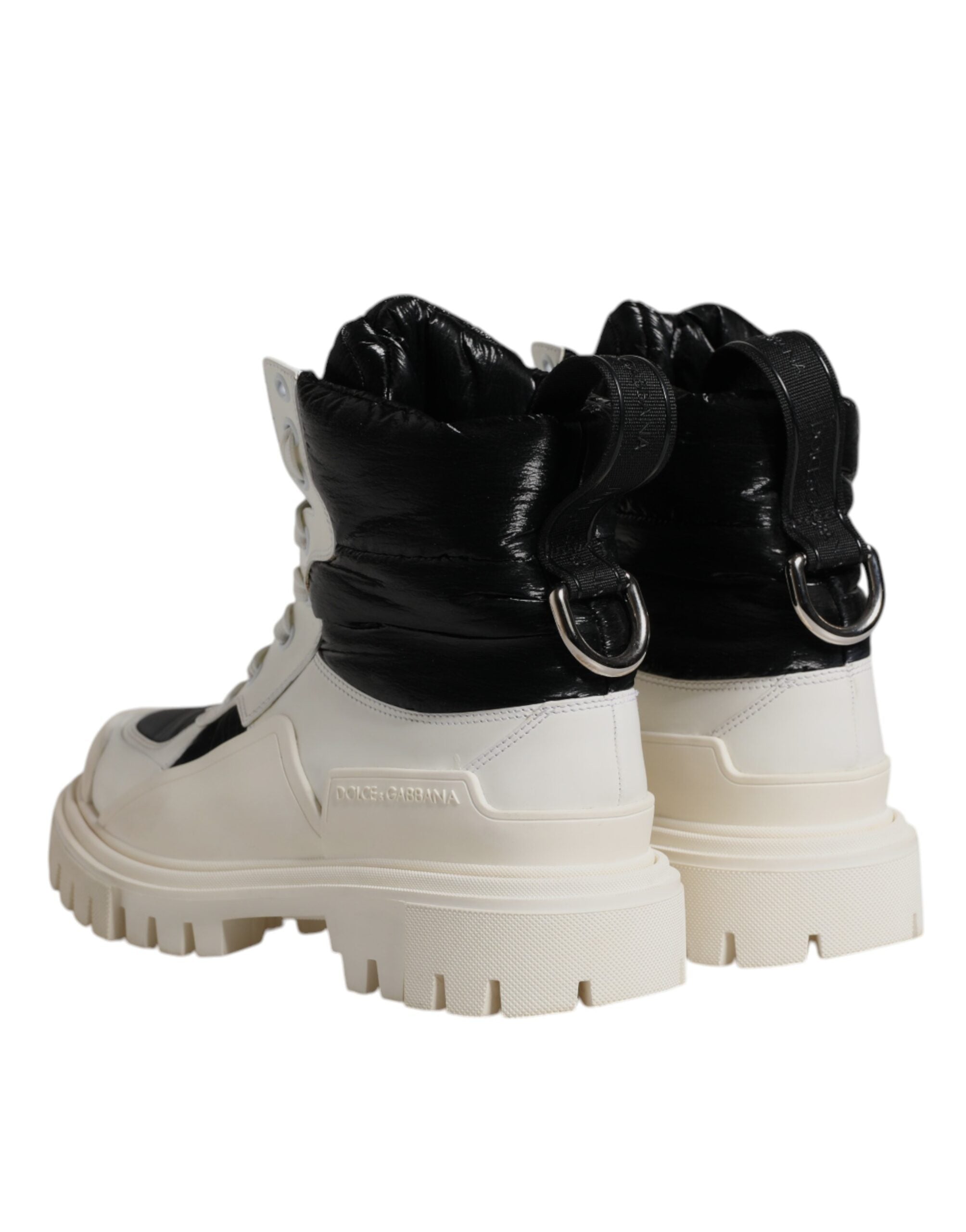 Step into luxury with Dolce & Gabbana's White Padded Mid Calf Lace Up Boots, where exquisite Italian craftsmanship meets timeless elegance for the discerning individual.