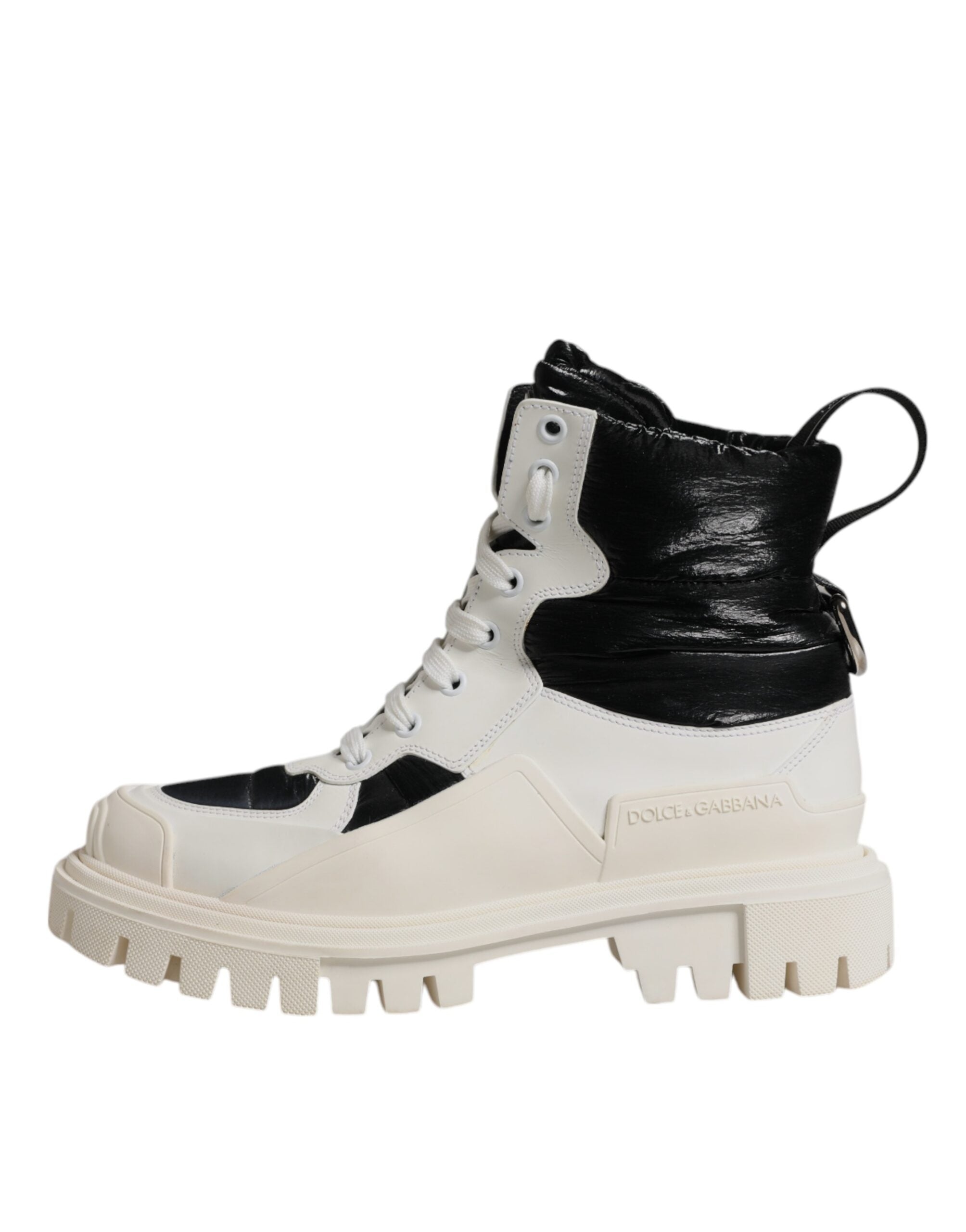 Elevate your style with Dolce & Gabbana's White Padded Mid Calf Lace Up Boots, a fusion of luxurious calf leather and Italian craftsmanship for timeless allure.