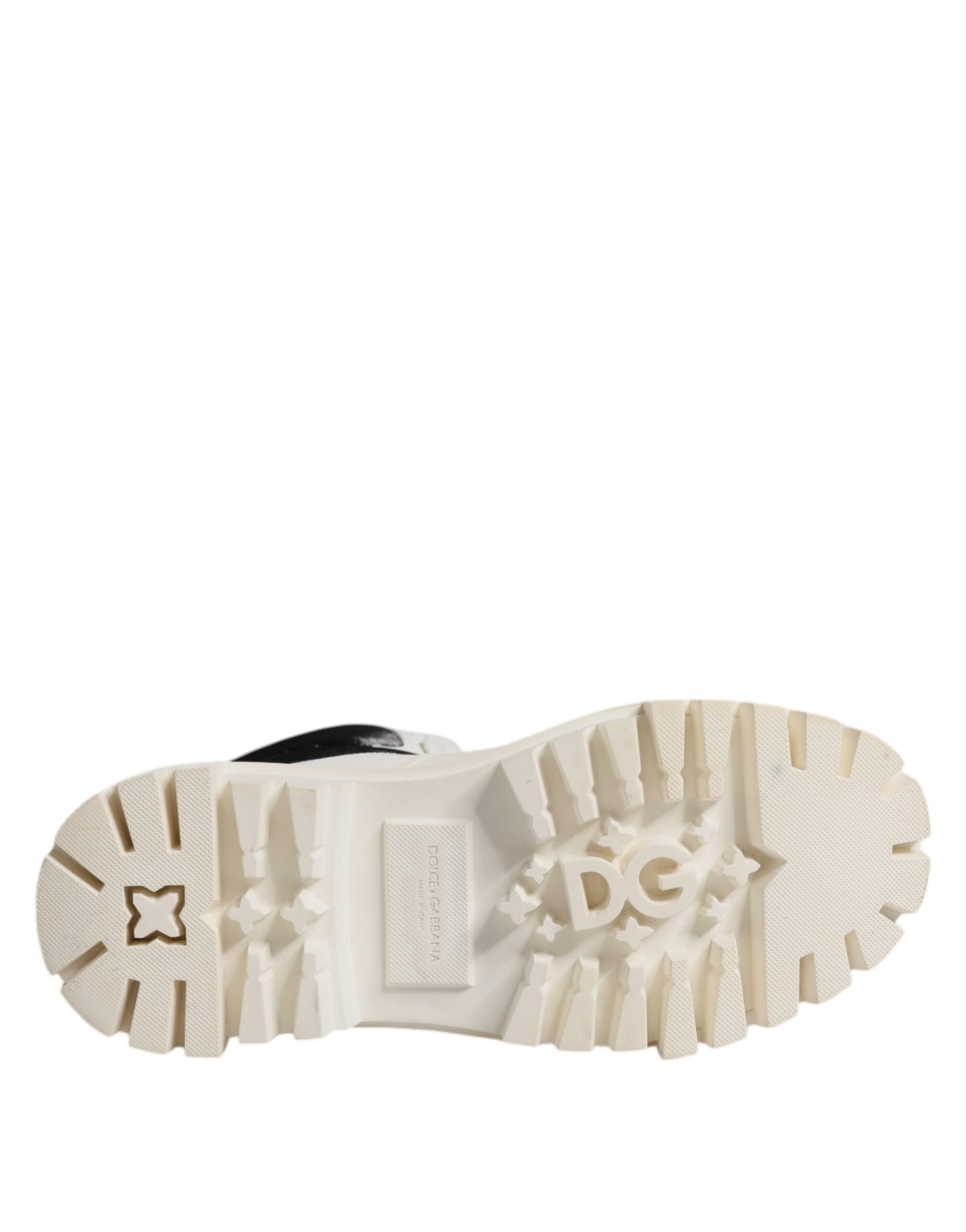 Step into the realm of luxury with Dolce & Gabbana's White Padded Mid Calf Lace Up Boots, where exquisite Italian craftsmanship meets timeless elegance for the discerning individual.