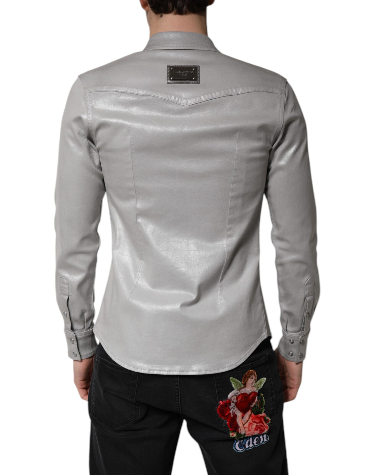 Elevate your wardrobe with the Dolce & Gabbana Metallic Gray Cotton Button Down Shirt, a masterpiece of Italian craftsmanship that embodies timeless elegance and versatile sophistication.