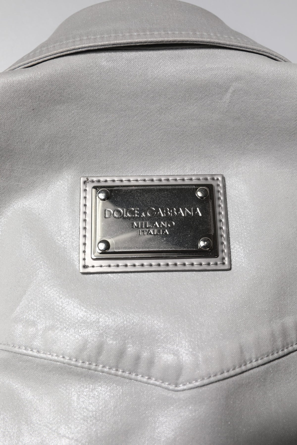 Indulge in the Dolce & Gabbana Metallic Gray Cotton Button Down Shirt, a masterpiece of Italian craftsmanship that embodies timeless elegance and sophisticated allure.