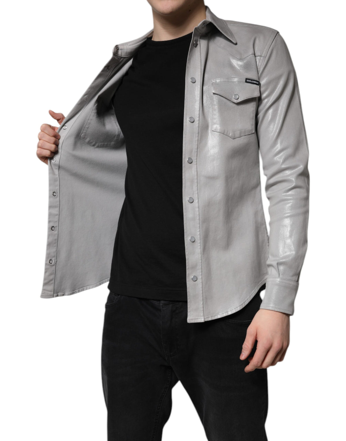 Indulge in the exquisite Dolce & Gabbana Metallic Gray Cotton Button Down Shirt, a testament to Italian craftsmanship, blending luxurious cotton with timeless elegance for the discerning individual.