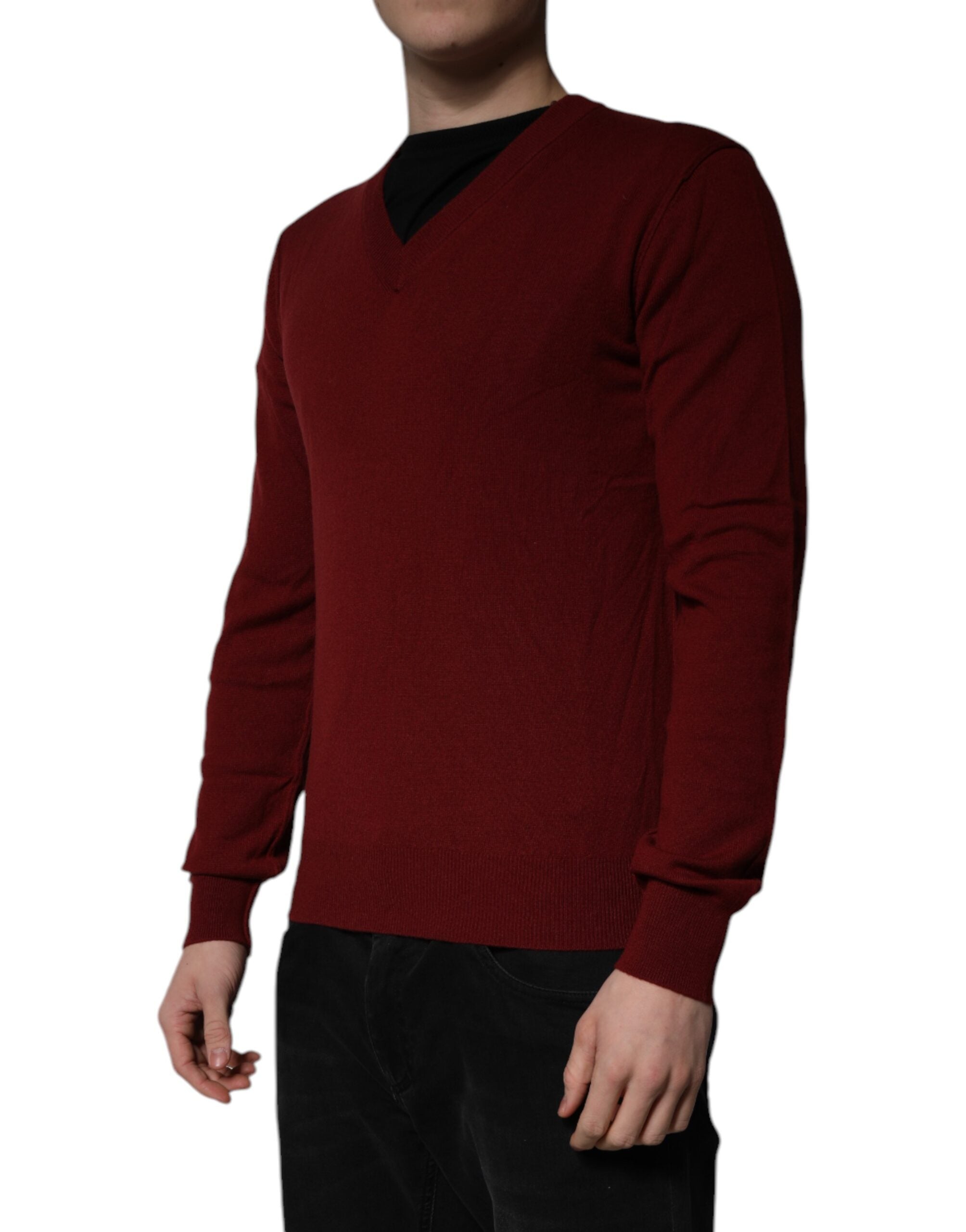 Indulge in the exquisite Dolce & Gabbana Maroon Cashmere V-neck Pullover Sweater, a timeless piece of luxury crafted from 100% cashmere, embodying refined elegance and sophistication.