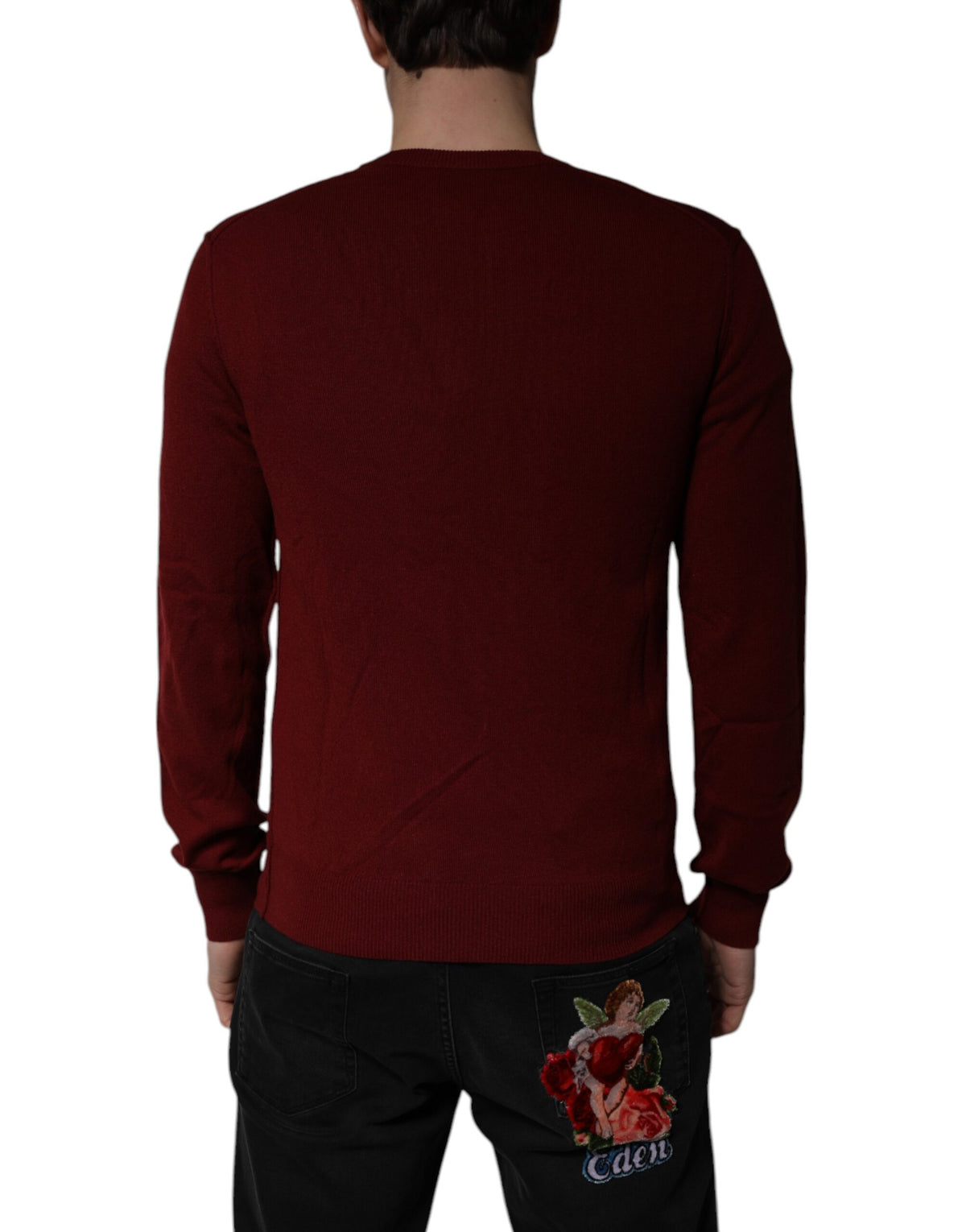 Elevate your wardrobe with the Dolce & Gabbana Maroon Cashmere V-neck Pullover Sweater, a masterpiece of Italian craftsmanship that embodies timeless luxury and sophistication.
