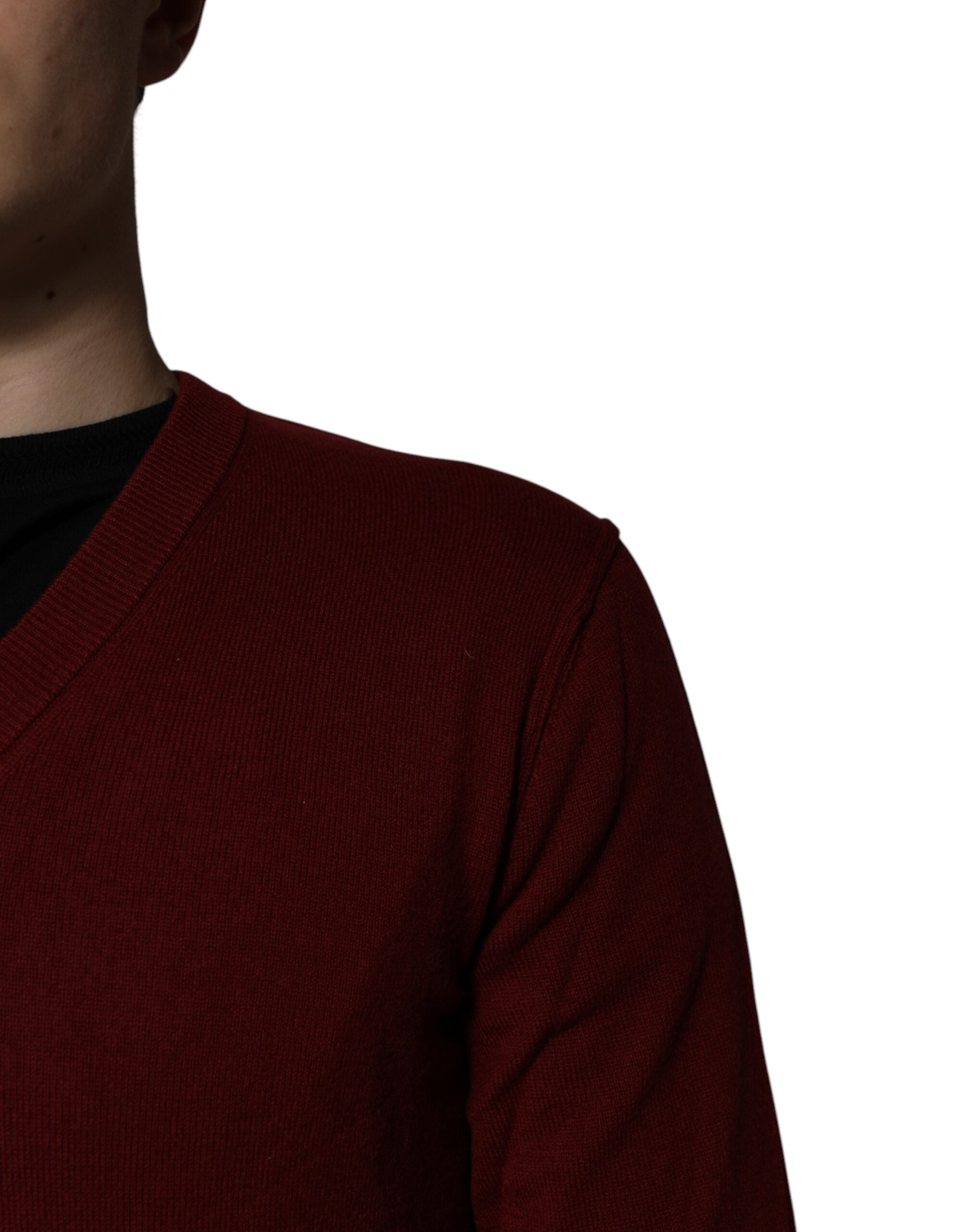 Elevate your wardrobe with the Dolce & Gabbana Maroon Cashmere V-neck Pullover Sweater, a masterpiece of Italian craftsmanship that embodies timeless luxury and sophistication.