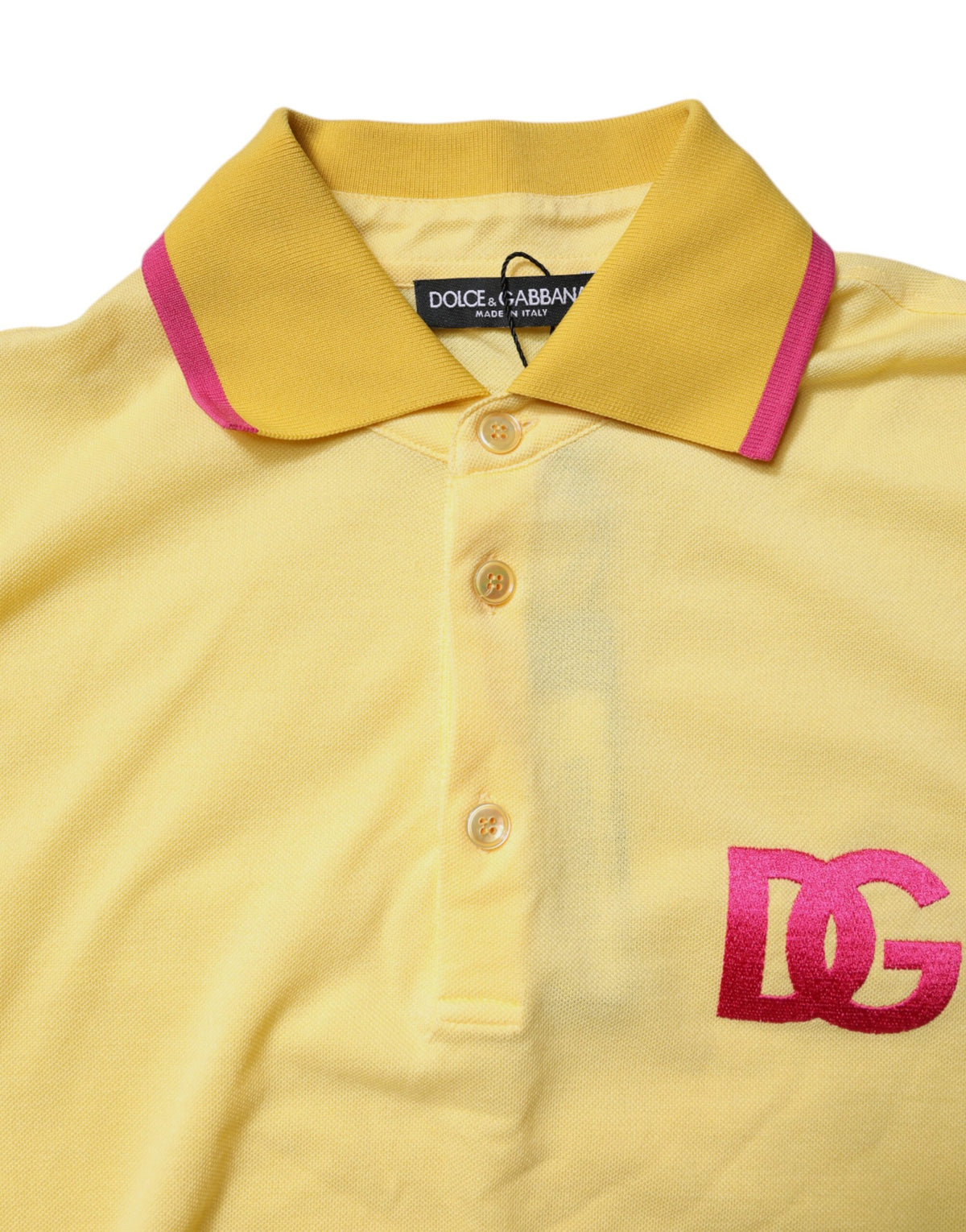 Discover the Dolce & Gabbana Yellow Cotton Logo Collared Polo T-shirt, a masterpiece of Italian craftsmanship that embodies vibrant luxury and timeless elegance for the discerning individual.