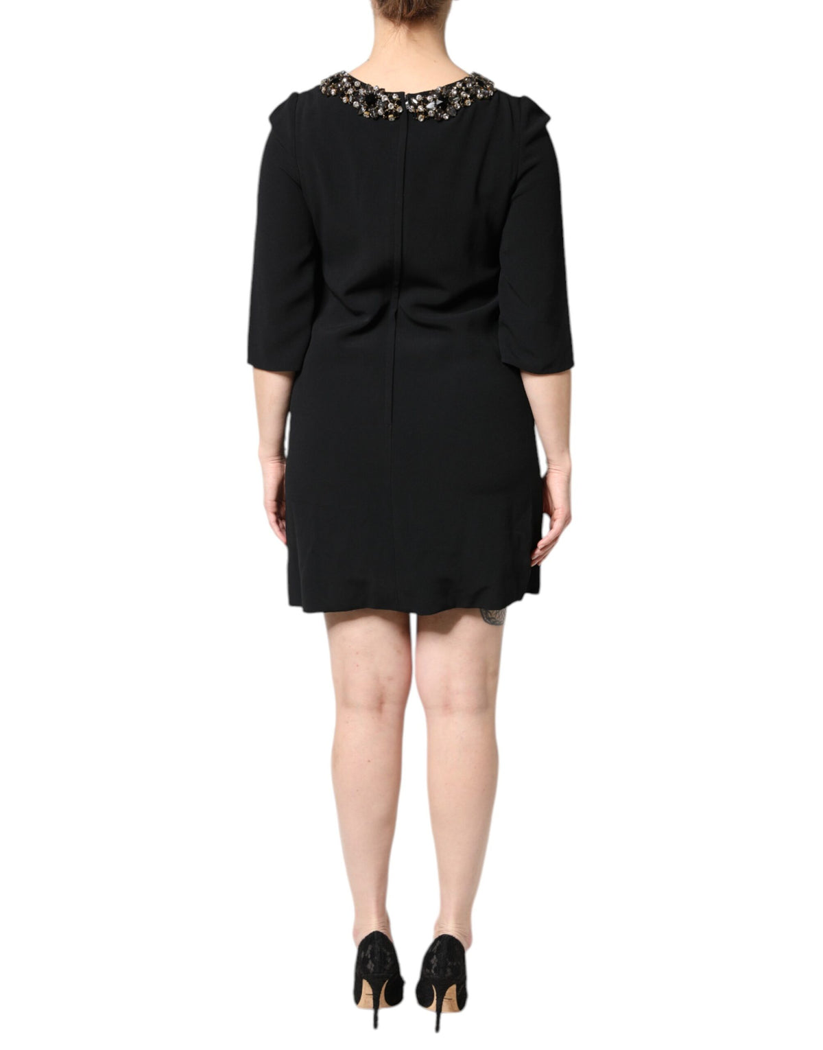Elevate your elegance with the Dolce & Gabbana Black Crystal Embellished Round Neck Mini Dress, a masterpiece of Italian craftsmanship, perfect for unforgettable soirées.