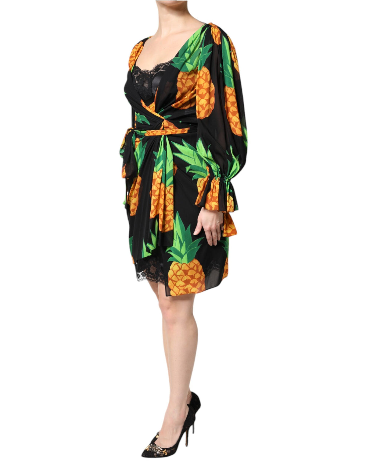 Indulge in the exquisite elegance of the Dolce & Gabbana Black Silk Pineapple Draped Print Wrap Dress, a masterpiece of Italian craftsmanship that embodies luxury and allure.