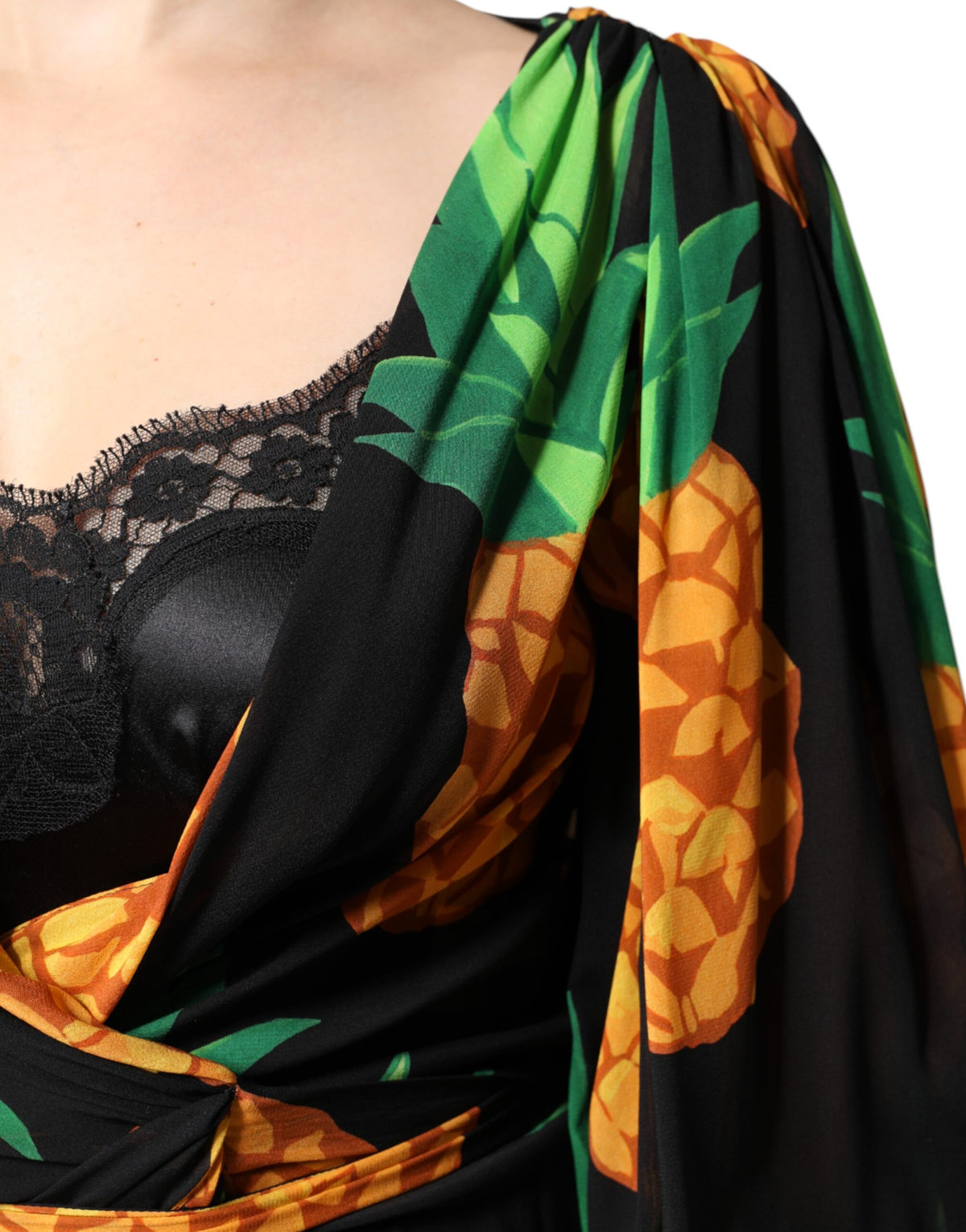 Indulge in the exquisite Dolce & Gabbana Black Silk Pineapple Draped Print Wrap Dress, a masterpiece of Italian craftsmanship that embodies elegance and allure for unforgettable moments.