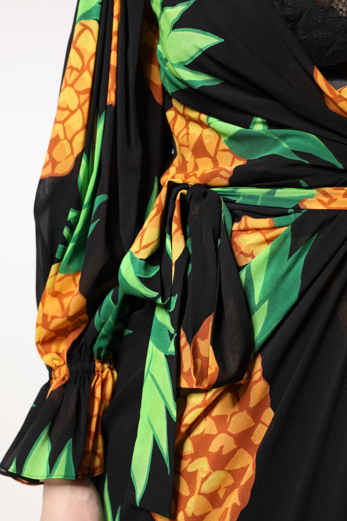 Elevate your wardrobe with the Dolce & Gabbana Black Silk Pineapple Draped Print Wrap Dress, a masterpiece of Italian craftsmanship that embodies luxury and allure.