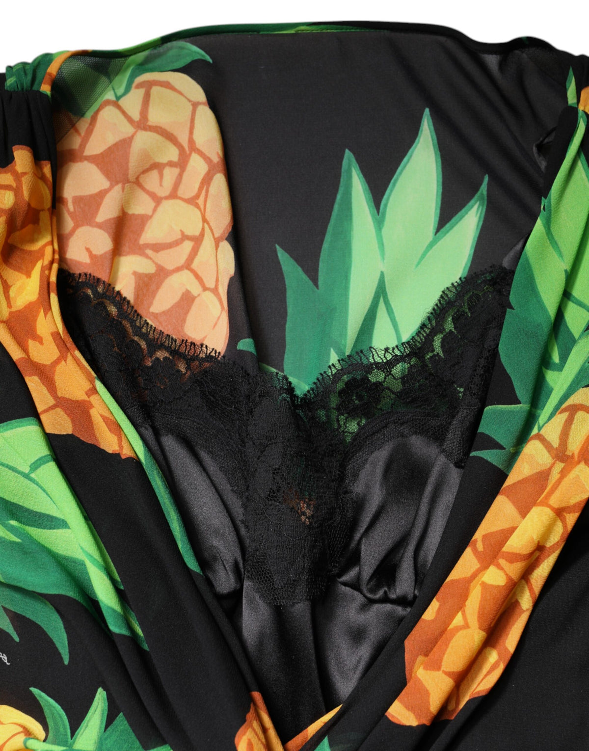 Elevate your wardrobe with the Dolce & Gabbana Black Silk Pineapple Draped Print Wrap Dress, a masterpiece of Italian craftsmanship that embodies luxury and allure.