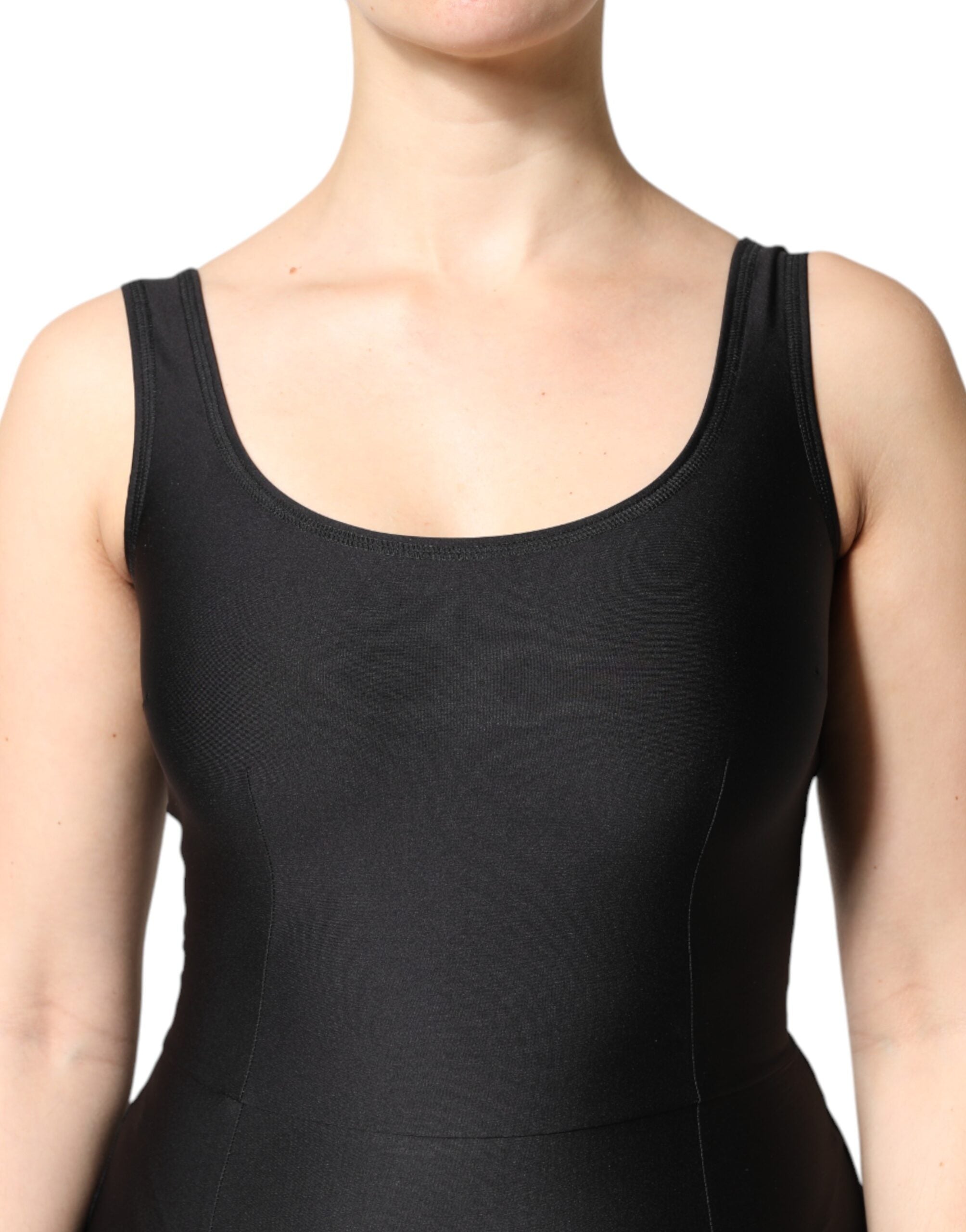 Experience the allure of the Dolce & Gabbana Black Sleeveless Bodycon Jumpsuit Dress, a masterpiece of Italian craftsmanship that embodies luxury and sophistication.
