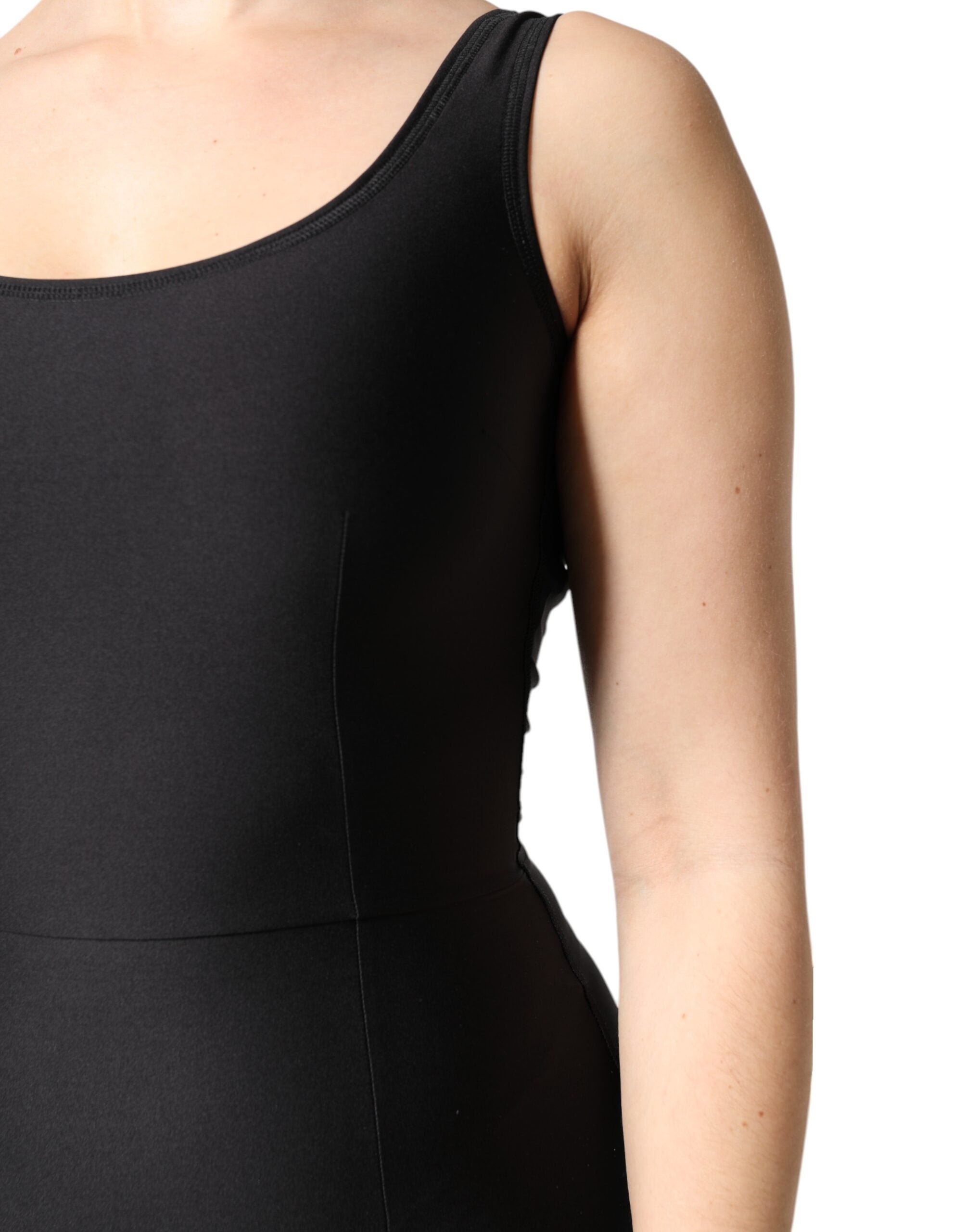 Elevate your wardrobe with the Dolce & Gabbana Black Sleeveless Bodycon Jumpsuit Dress, a masterpiece of Italian craftsmanship that embodies timeless elegance and luxurious allure.