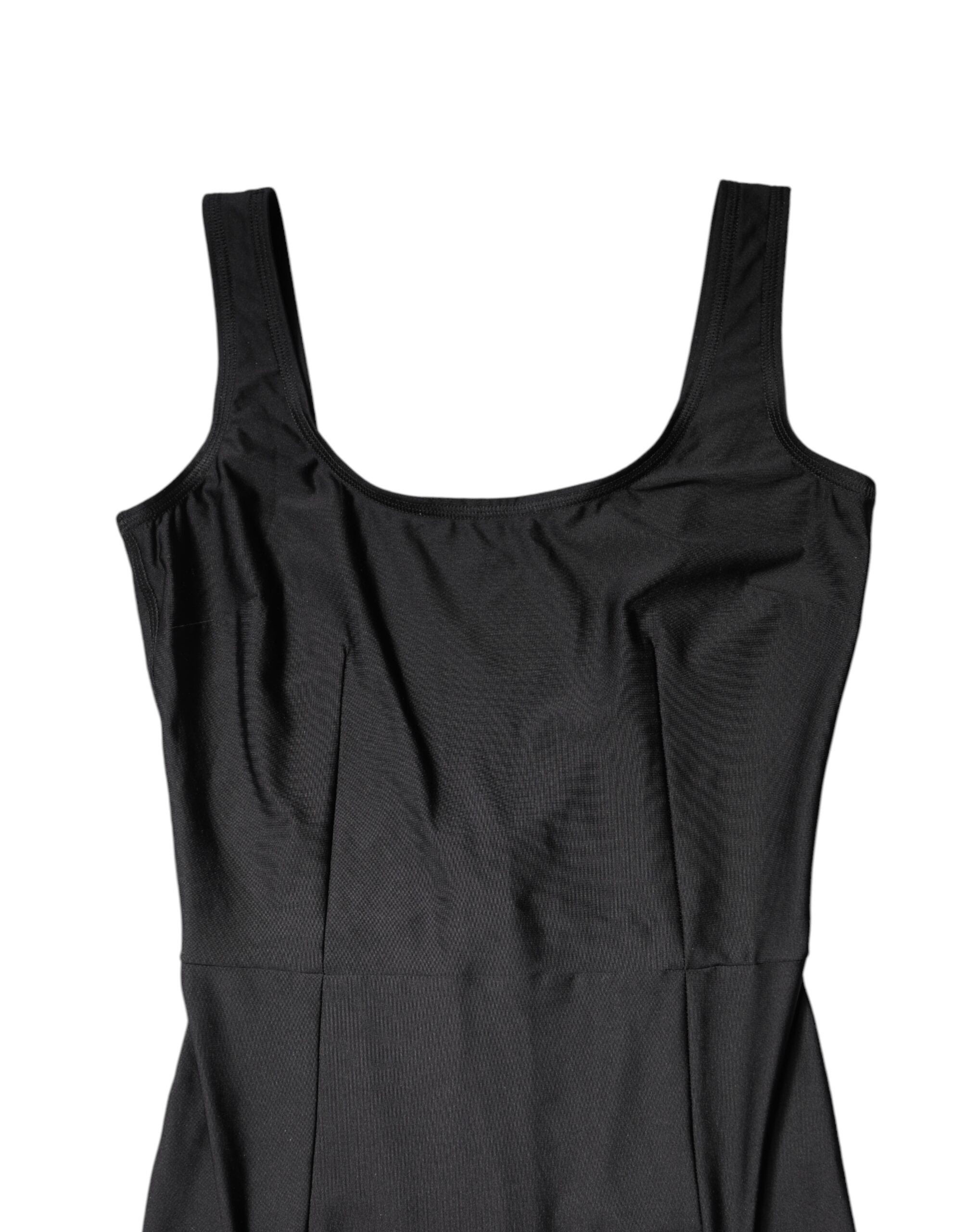 Experience the allure of the Dolce & Gabbana Black Sleeveless Bodycon Jumpsuit Dress, where exquisite Italian craftsmanship meets luxurious materials for a captivating silhouette.