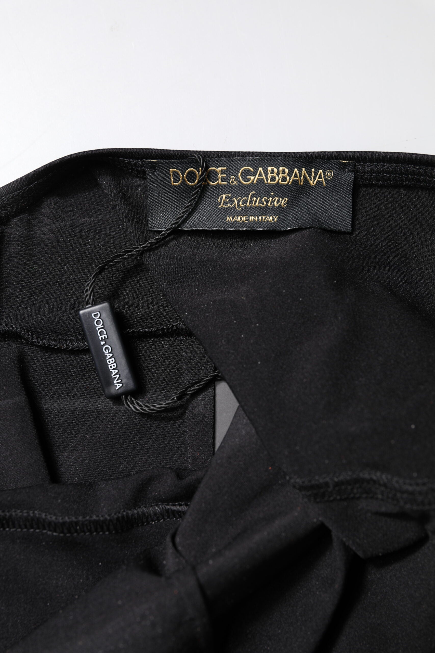 Elevate your wardrobe with the Dolce & Gabbana Black Sleeveless Bodycon Jumpsuit Dress, a masterpiece of Italian craftsmanship that embodies timeless elegance and luxurious allure.