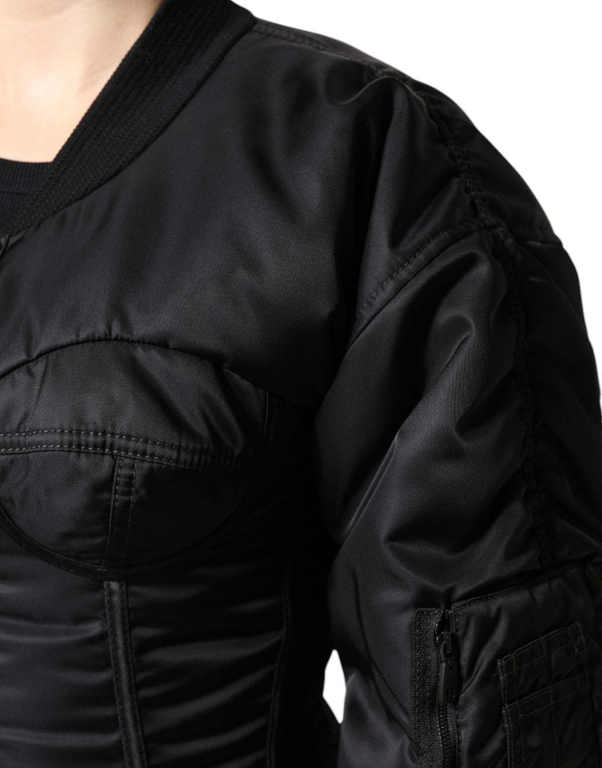 Elevate your wardrobe with the Dolce & Gabbana Black Nylon Full Zip Bustier Corset Jacket, a luxurious blend of exquisite craftsmanship and modern sophistication.