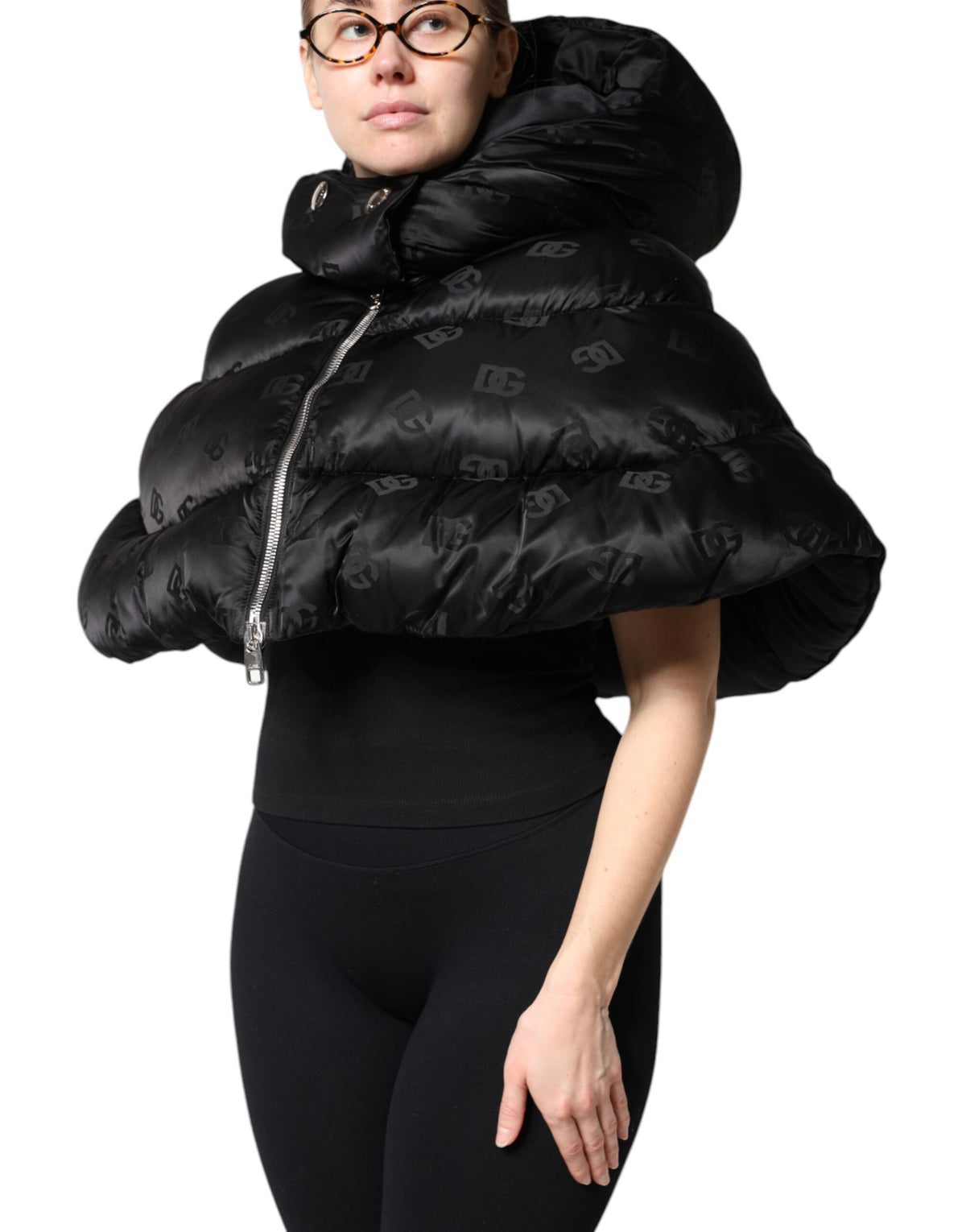 Indulge in the exquisite Dolce & Gabbana Black Padded Puffer Hooded Jacket, a luxurious blend of high-quality nylon and Italian craftsmanship, perfect for elevating your style.