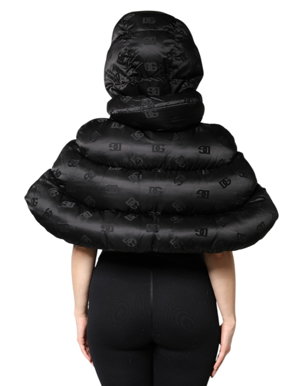 Indulge in the exquisite Dolce & Gabbana Black Padded Puffer Hooded Full Zip Cropped Jacket, a luxurious blend of premium nylon and Italian craftsmanship, perfect for the discerning fashion connoisseur.