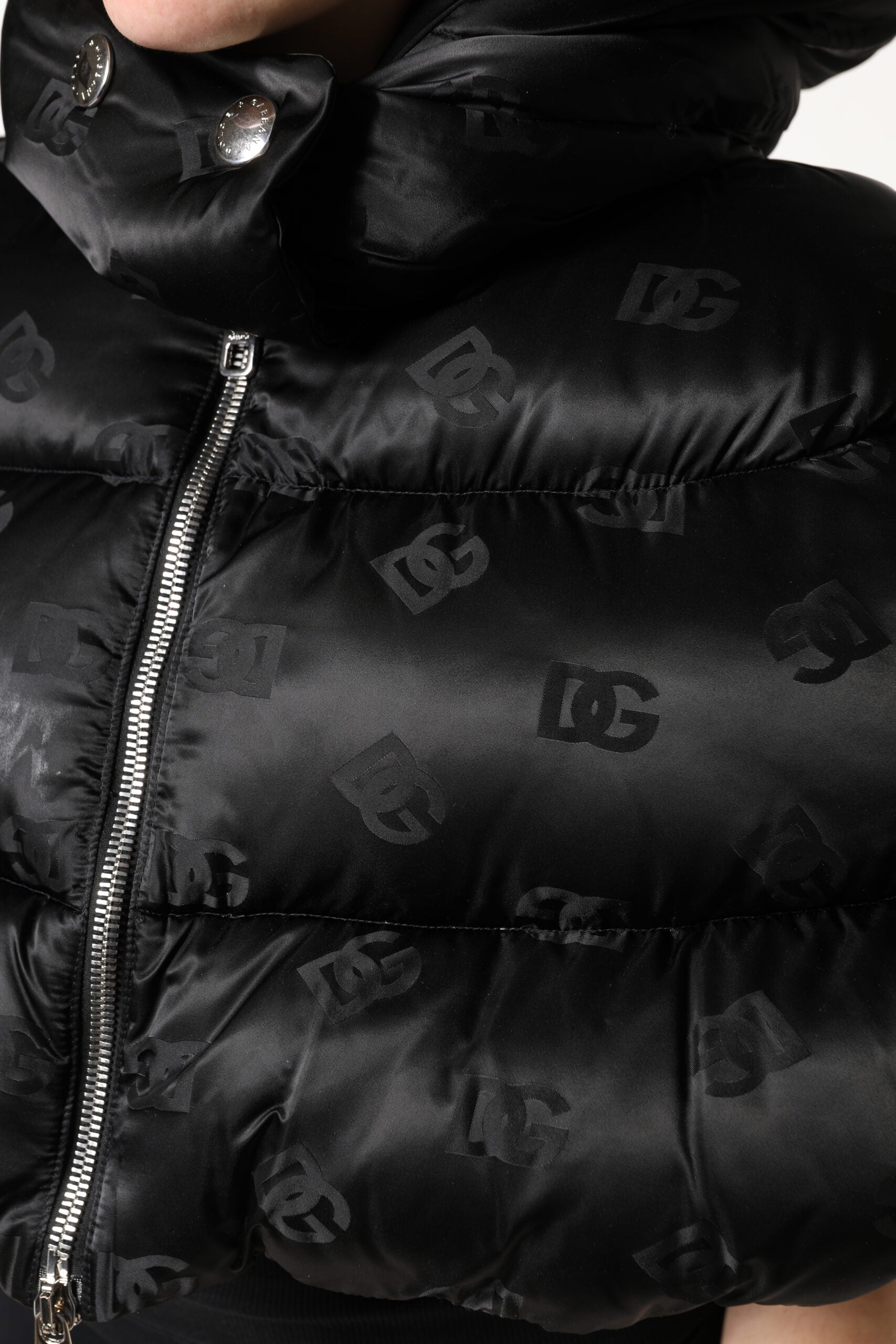 Indulge in the exquisite Dolce & Gabbana Black Padded Puffer Hooded Jacket, a masterpiece of Italian craftsmanship in luxurious nylon, perfect for elevating your style.