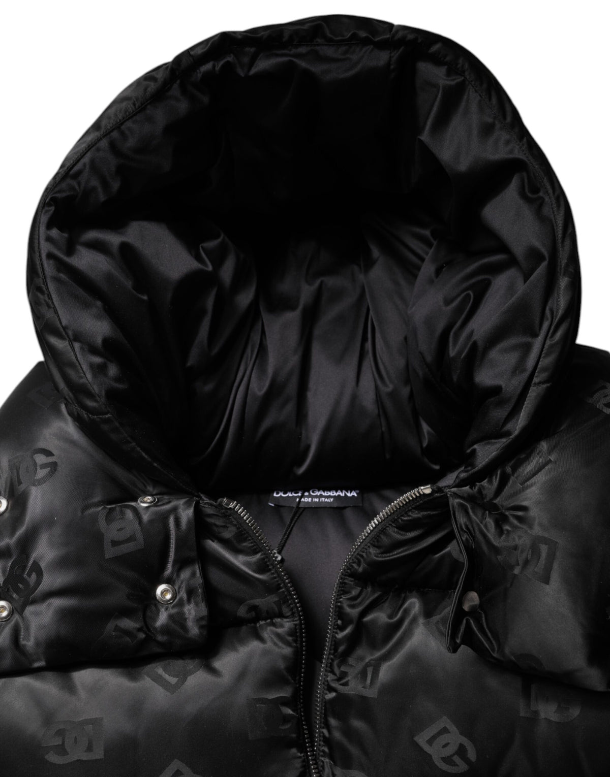 Indulge in the exquisite Dolce & Gabbana Black Padded Puffer Hooded Jacket, a luxurious blend of premium nylon and Italian craftsmanship, perfect for the discerning fashion connoisseur.