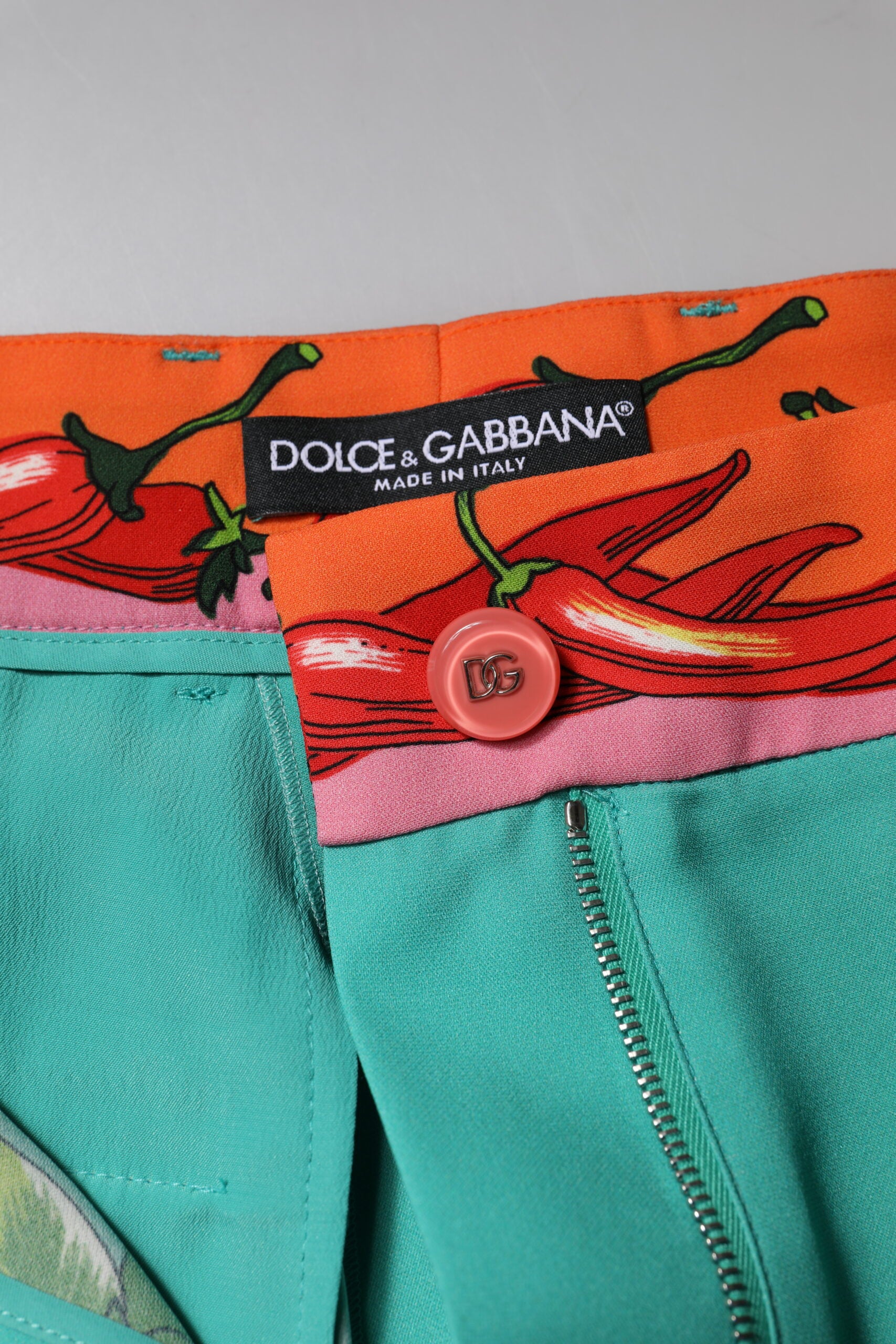 Indulge in the exquisite Dolce & Gabbana Green Silk Printed Straight Pants, where Italian craftsmanship meets luxurious silk, perfect for elevating any occasion with elegance.