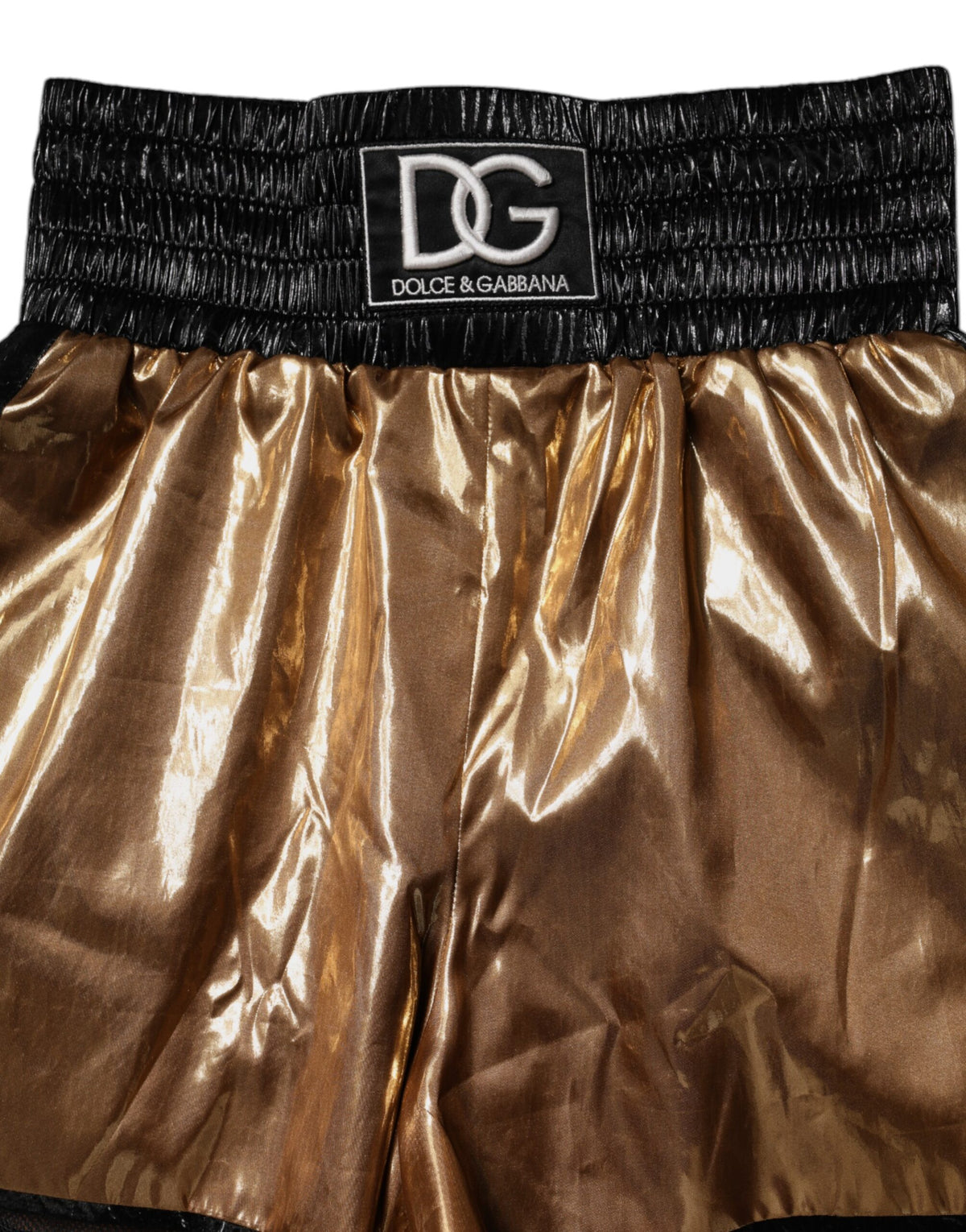 Elevate your wardrobe with Dolce & Gabbana's Metallic Gold High Waist Hotpants, a luxurious blend of refined craftsmanship and exquisite materials, perfect for any sophisticated occasion.