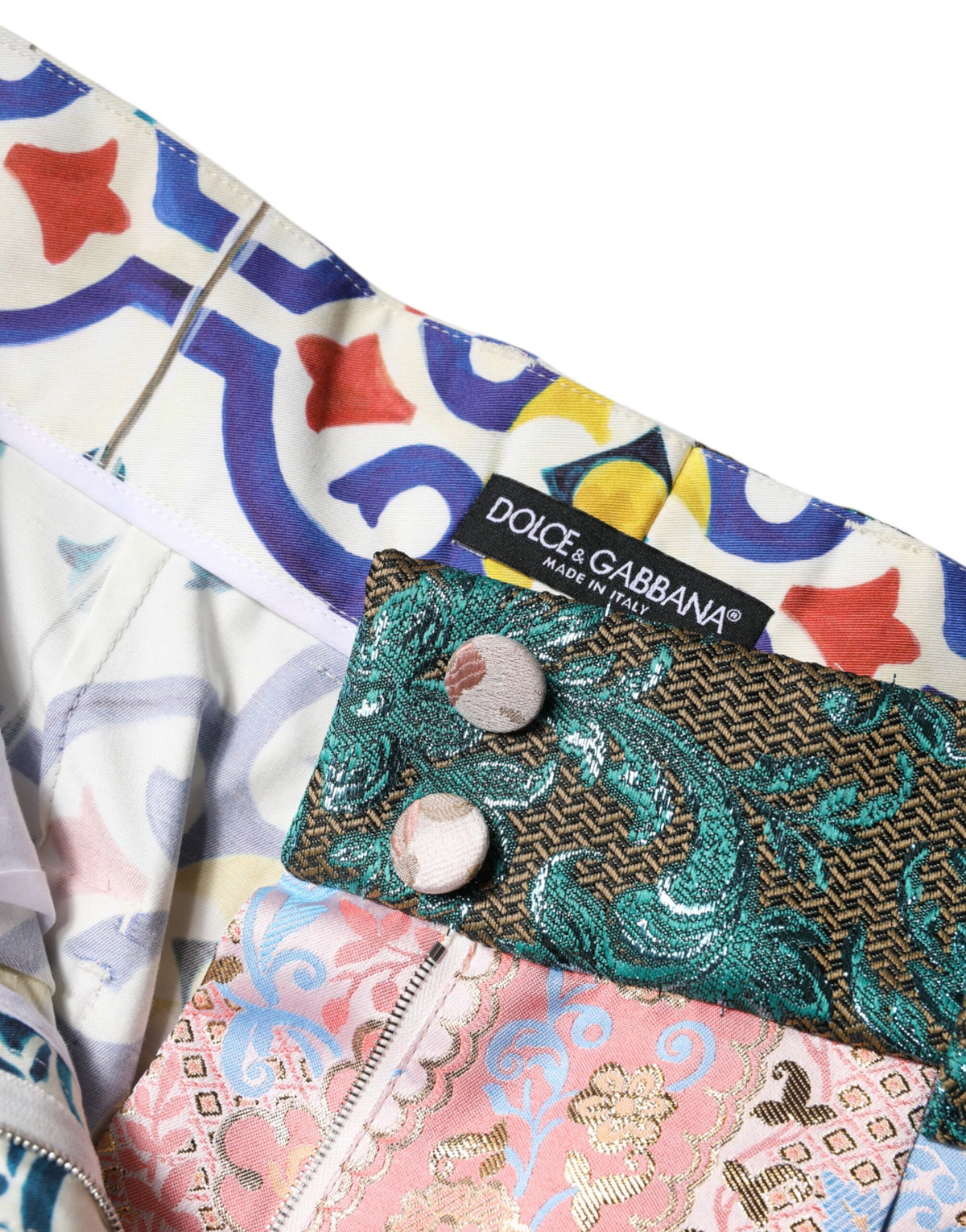 Indulge in the exquisite Dolce & Gabbana Multicolor Cotton Patchwork Hot Pants, where artisan craftsmanship meets luxurious materials for a bold statement in haute couture fashion.