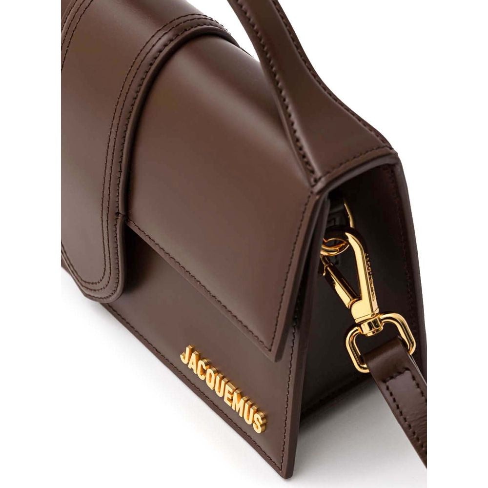Indulge in the Jacquemus Brown Leather Handbag, a masterpiece of exquisite craftsmanship and timeless elegance, perfect for the discerning individual who values luxury.