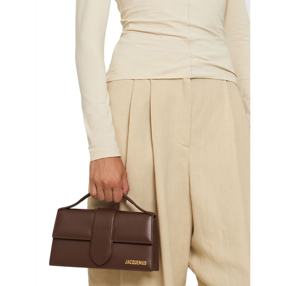 Discover the Jacquemus Brown Leather Handbag, a masterpiece of exquisite craftsmanship and timeless elegance, perfect for elevating any ensemble with luxurious allure.