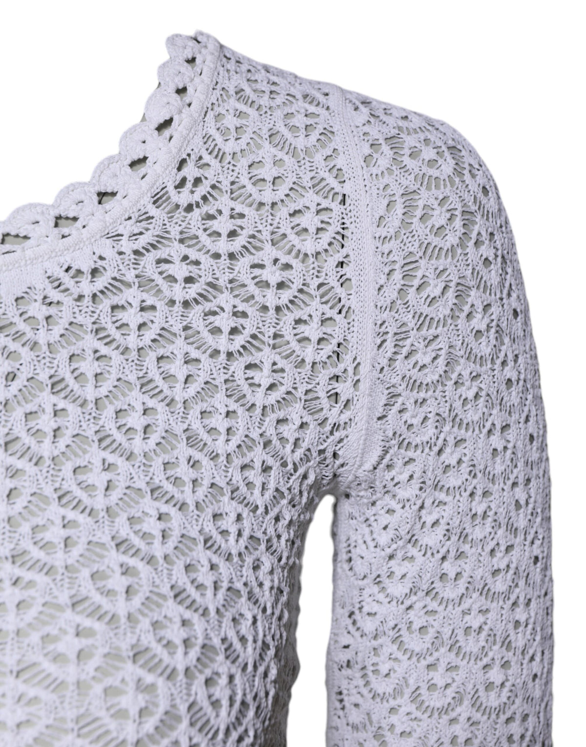 Indulge in the exquisite allure of Dolce & Gabbana's White Viscose Short Sleeve Crochet Top, a timeless piece crafted in Italy, embodying luxury and elegance for the discerning individual.