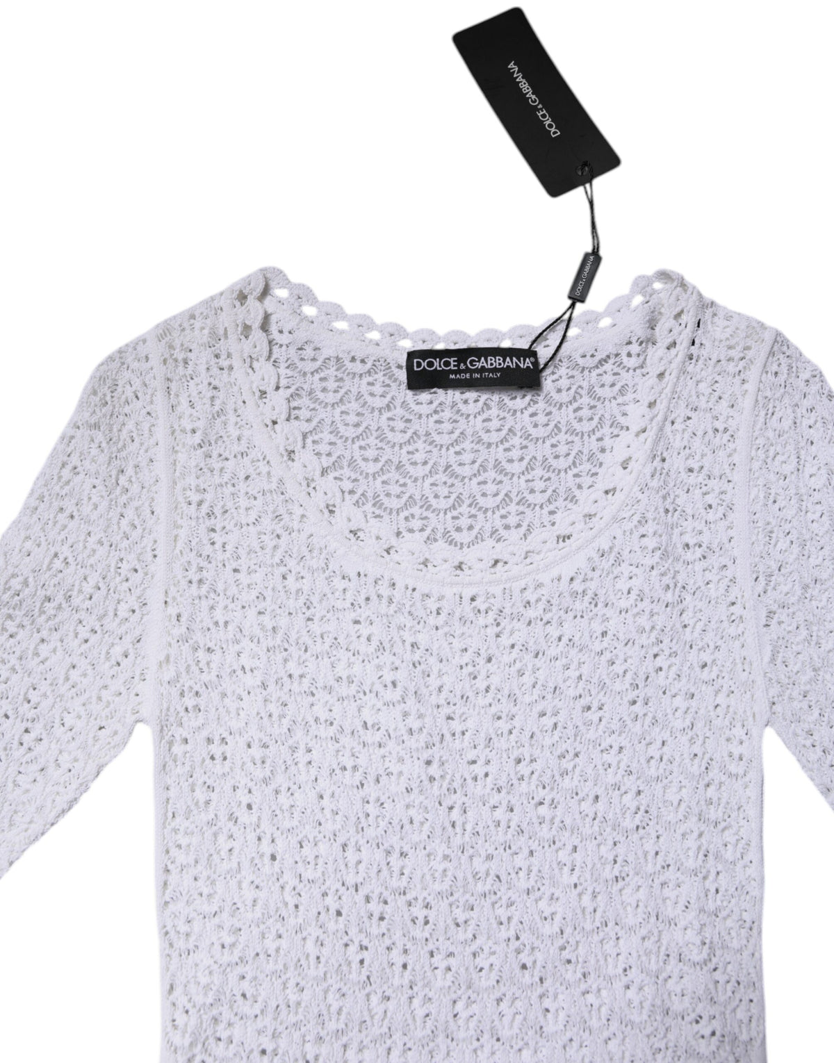 Indulge in the exquisite craftsmanship of Dolce & Gabbana's White Viscose Short Sleeve Crochet Top, a timeless piece that embodies luxury and elegance for the discerning individual.