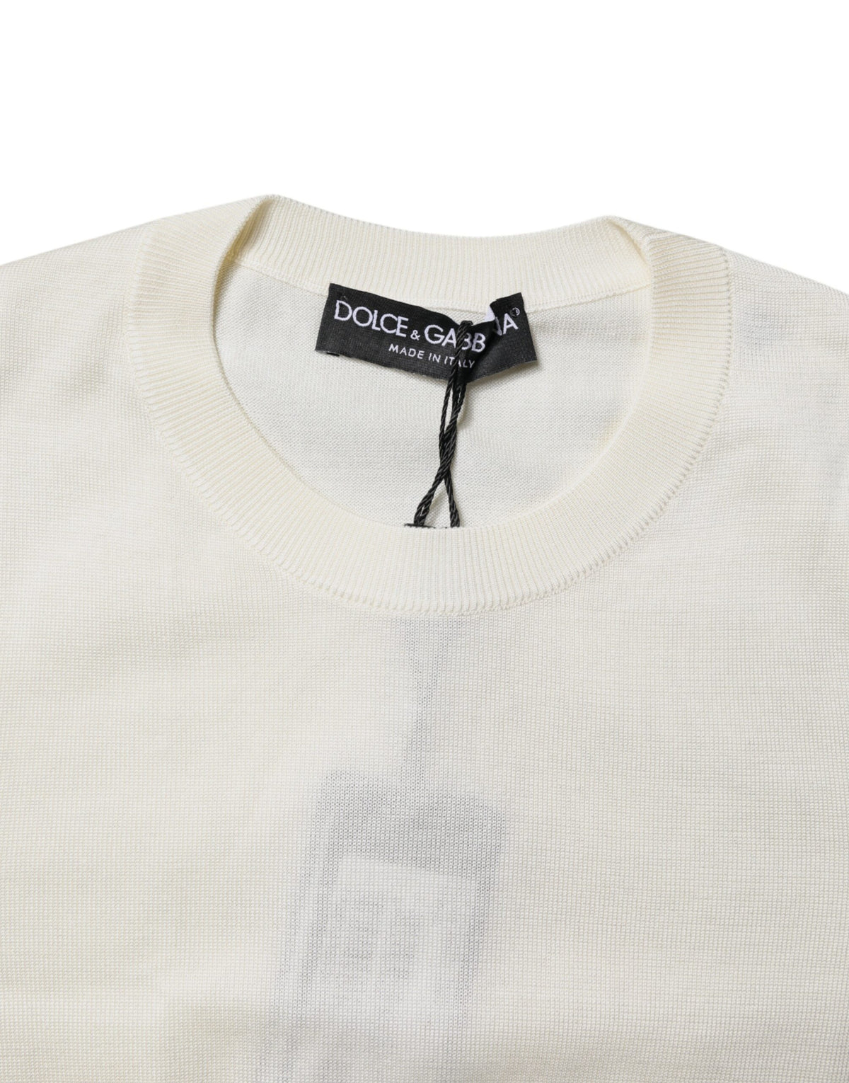 Experience the allure of Dolce & Gabbana's Cream Silk Blouse, a timeless piece crafted from 100% silk, embodying luxury and sophistication for the discerning individual.