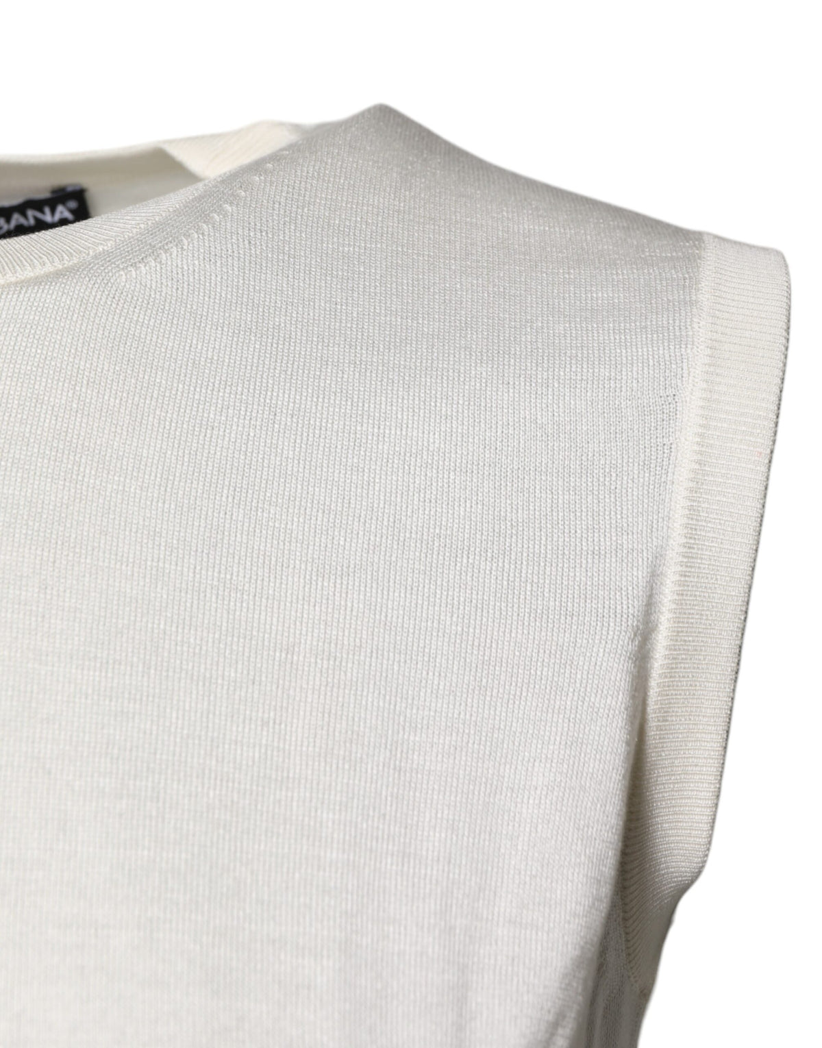 Elevate your elegance with the Dolce & Gabbana Cream Sleeveless Silk Round Neck Tank Top, a timeless piece crafted from luxurious silk, perfect for any sophisticated occasion.