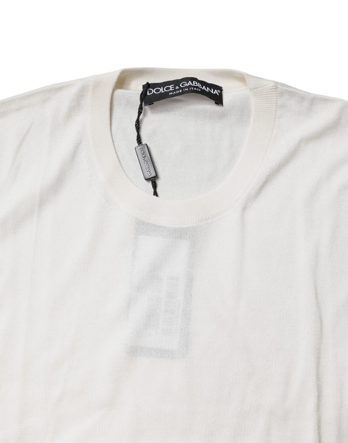 Elevate your elegance with the Dolce & Gabbana Cream Sleeveless Silk Round Neck Tank Top, a timeless masterpiece crafted from luxurious silk, perfect for any sophisticated occasion.