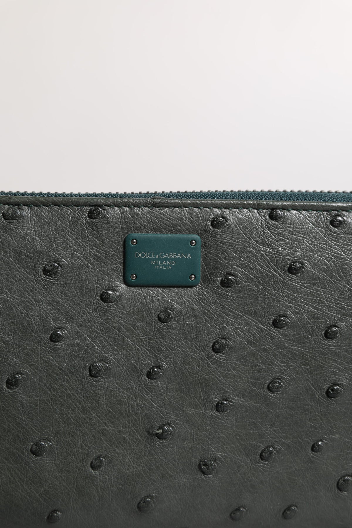 Indulge in the exquisite Dolce & Gabbana Green Ostrich Logo Plaque Zip Around Continental Wallet, a luxurious blend of fine craftsmanship and refined elegance, perfect for the discerning connoisseur.