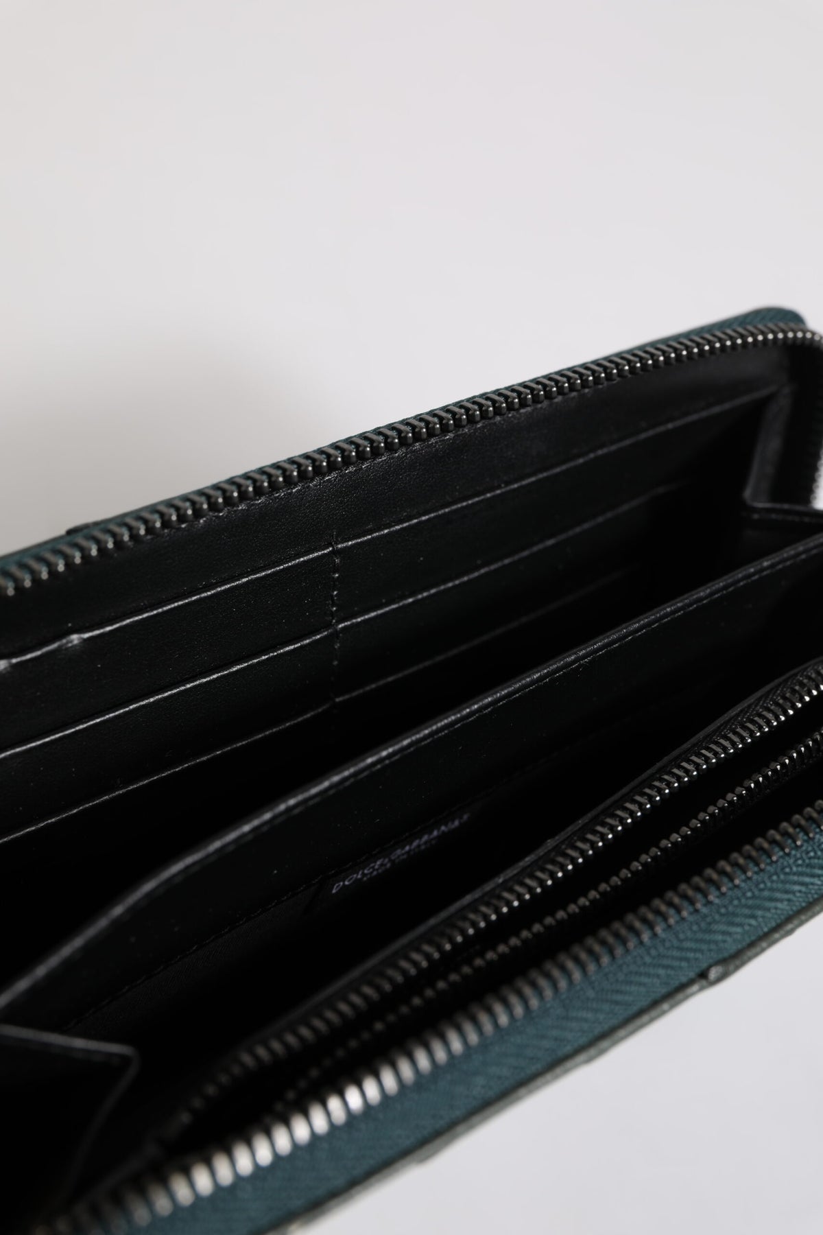 Indulge in the exquisite Dolce & Gabbana Green Ostrich Logo Plaque Zip Around Continental Wallet, a luxurious blend of artistry and function, perfect for the discerning connoisseur.