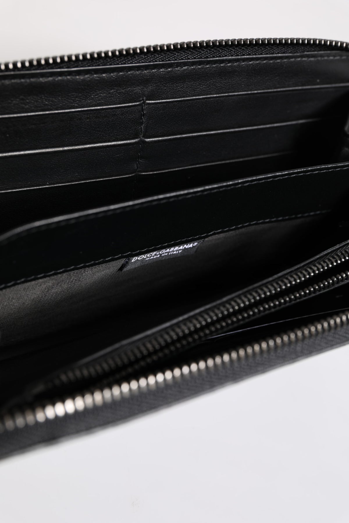 Indulge in the exquisite Dolce & Gabbana Black Blue Exotic Leather Embossed Continental Wallet, a luxurious blend of calfskin and land snake, embodying timeless elegance and sophistication.