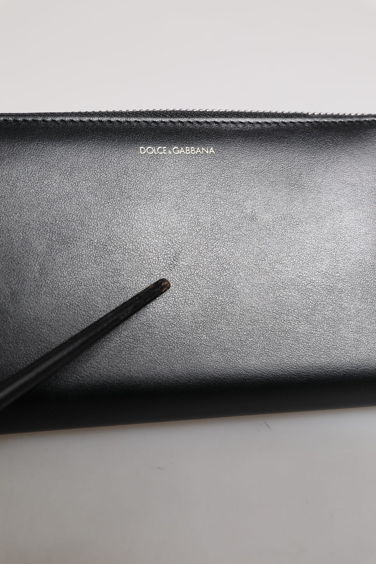 Indulge in the exquisite Dolce & Gabbana Black Blue Exotic Leather Embossed Continental Wallet, a masterpiece of calfskin and land snake leather, embodying timeless luxury and sophistication.