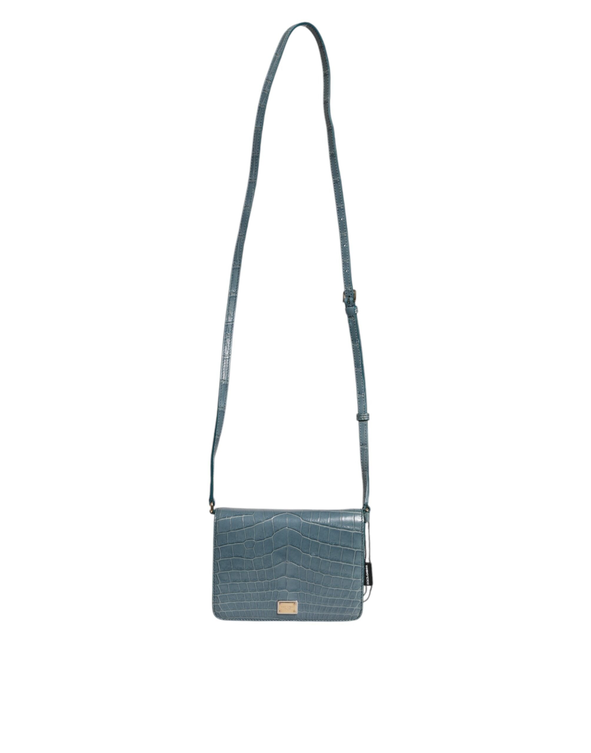 Elevate your style with the Dolce & Gabbana Green Exotic Leather DG Plaque Crossbody Mini Bag, a luxurious blend of crocodile and calf leather, crafted for the discerning individual.
