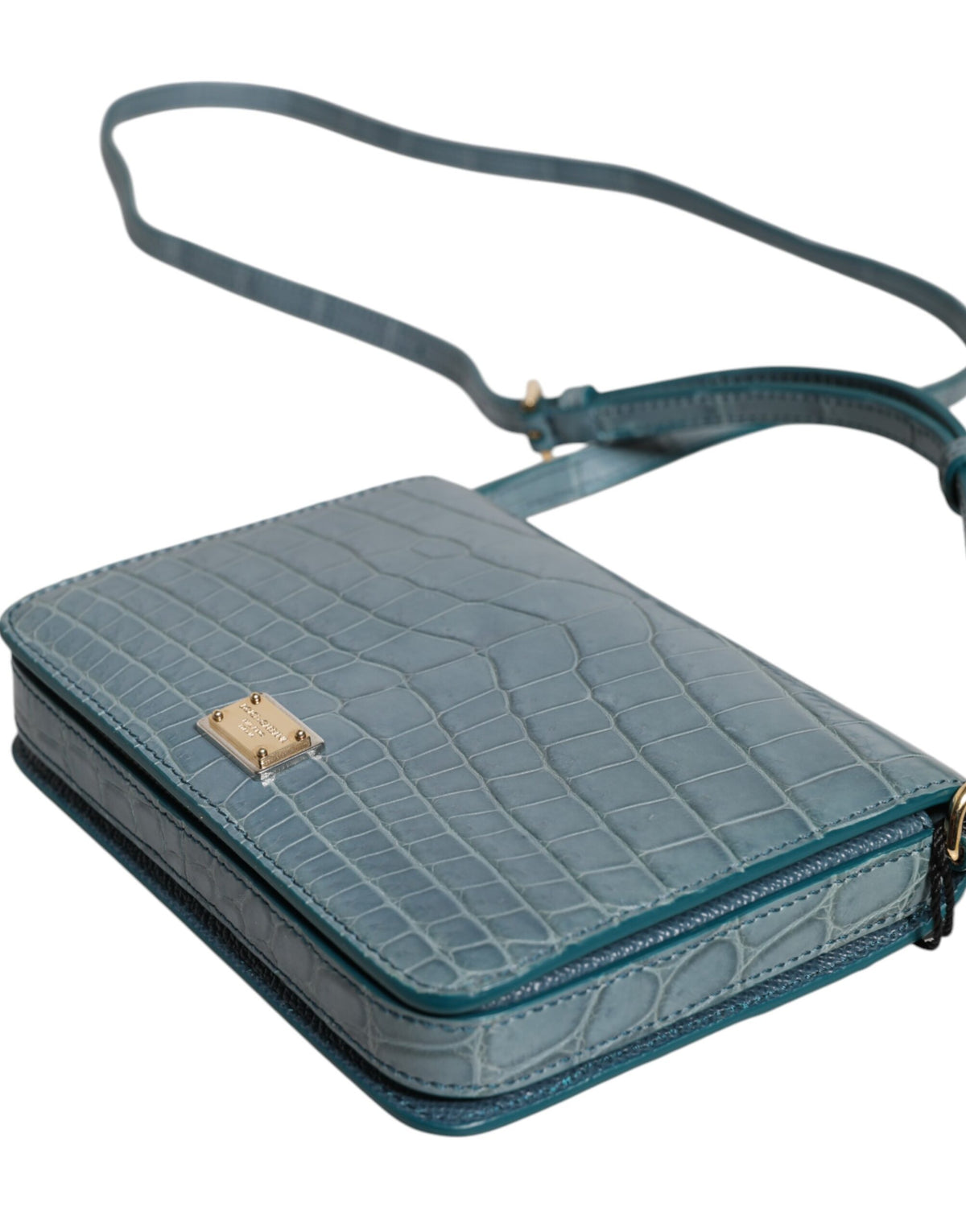 Discover the Dolce & Gabbana Green Exotic Leather DG Plaque Crossbody Mini Bag, a luxurious blend of crocodile and calf leather, elevating your style with exquisite craftsmanship and timeless elegance.
