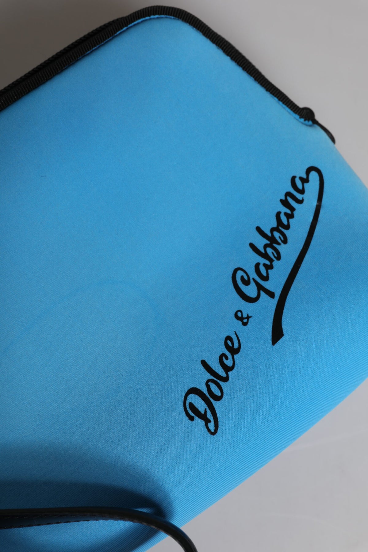 Discover the exquisite Dolce & Gabbana Blue DG Logo Print Clutch, a timeless luxury accessory crafted in Italy, blending elegance and sophistication for the discerning individual.