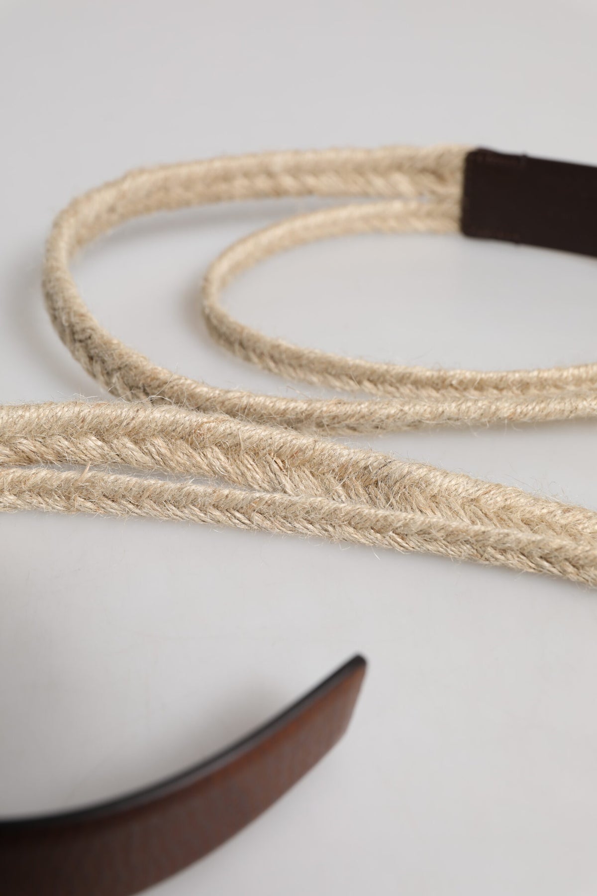 Elevate your style with the Dolce & Gabbana Brown Jute Leather Woven Metal Buckle Belt, a luxurious blend of jute and calf leather, embodying timeless elegance and artisanal craftsmanship.