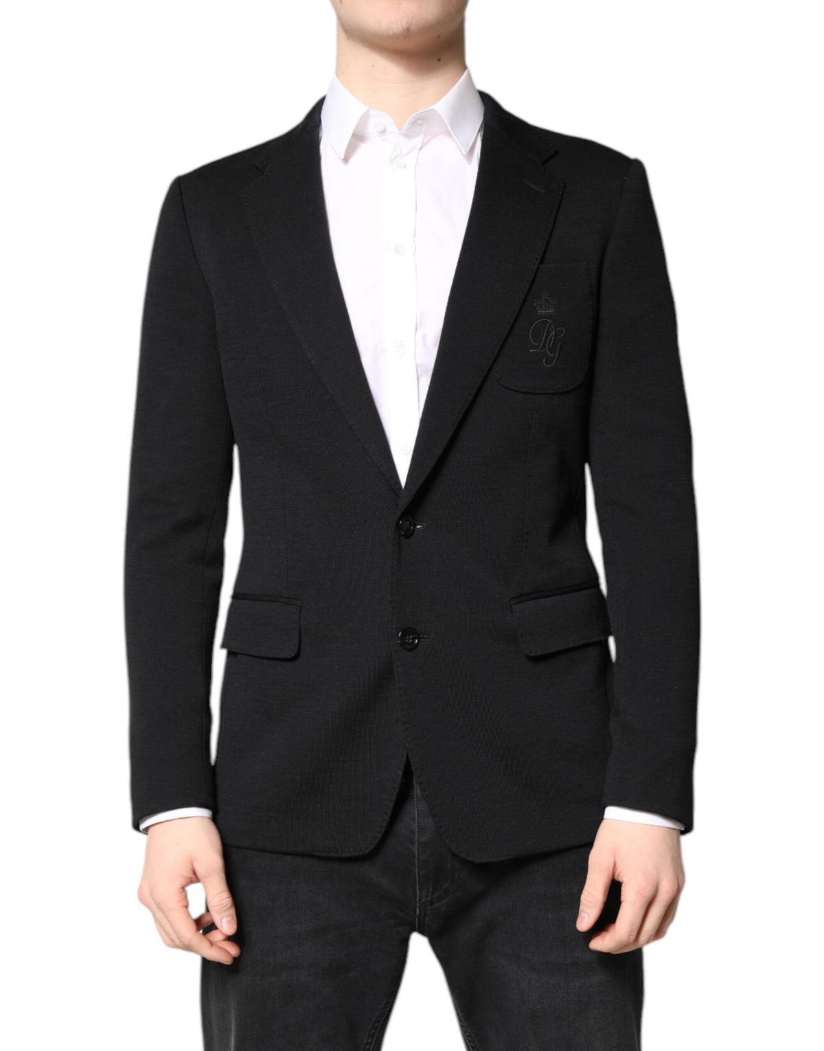 Elevate your wardrobe with the Dolce & Gabbana Black Wool Slim Fit Blazer, a masterpiece of Italian craftsmanship, blending luxury materials for timeless sophistication.