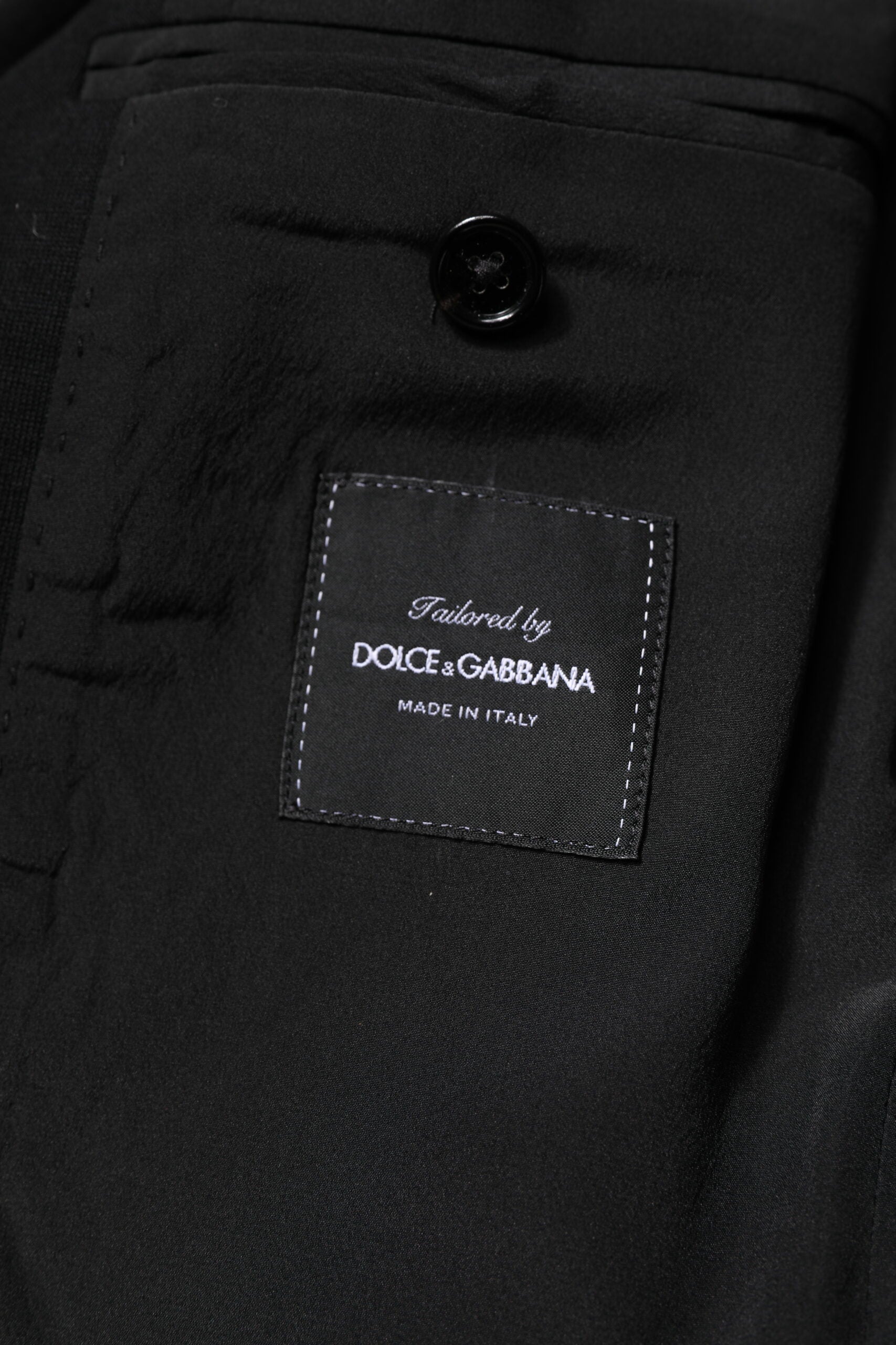 Experience the timeless elegance of Dolce & Gabbana's Black Wool Slim Fit Blazer, crafted from premium materials to elevate your sophisticated style and confidence.