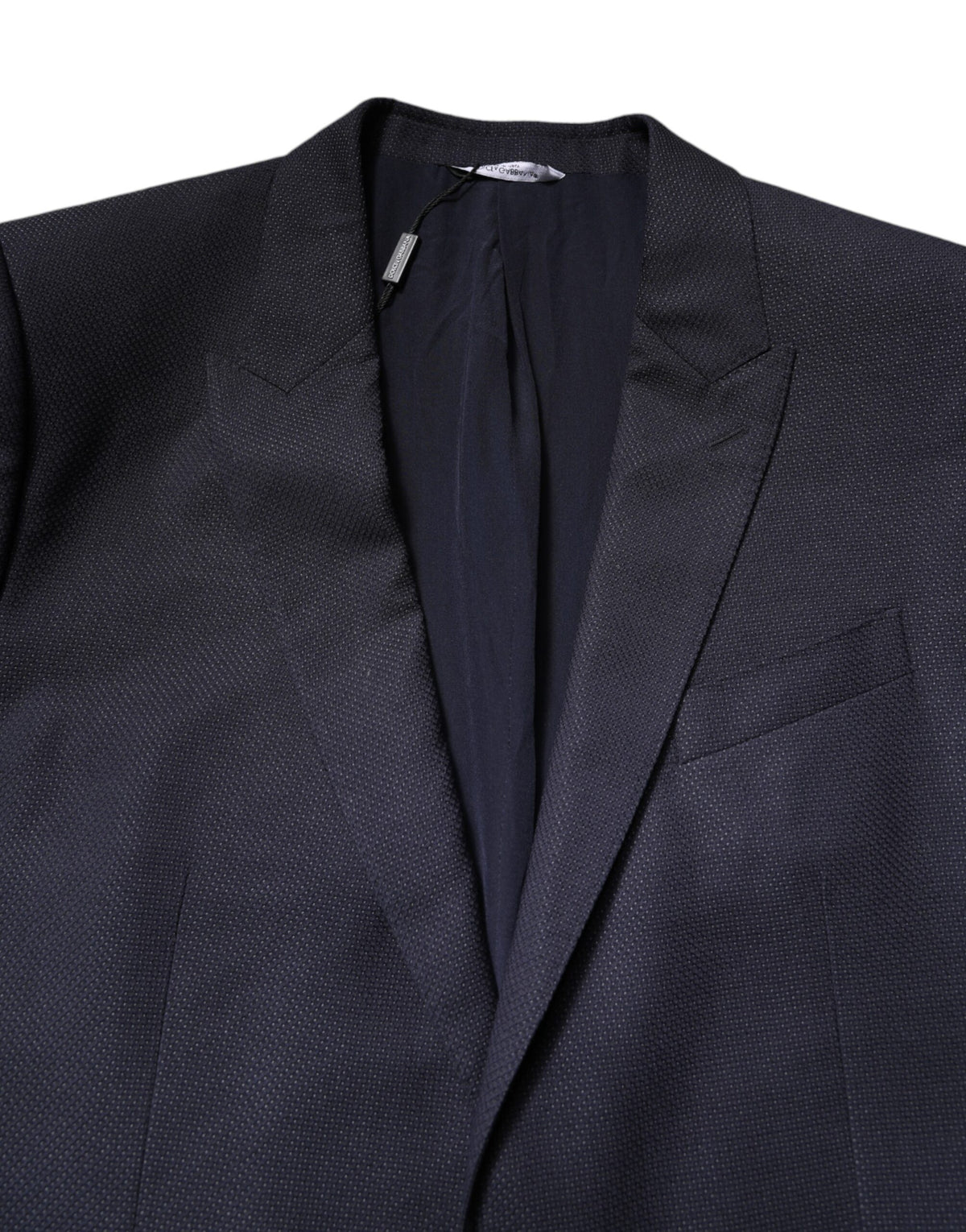 Experience the allure of Dolce & Gabbana's Black Wool Blazer Suit, a masterpiece of Italian craftsmanship in luxurious virgin wool and silk, perfect for the discerning connoisseur.